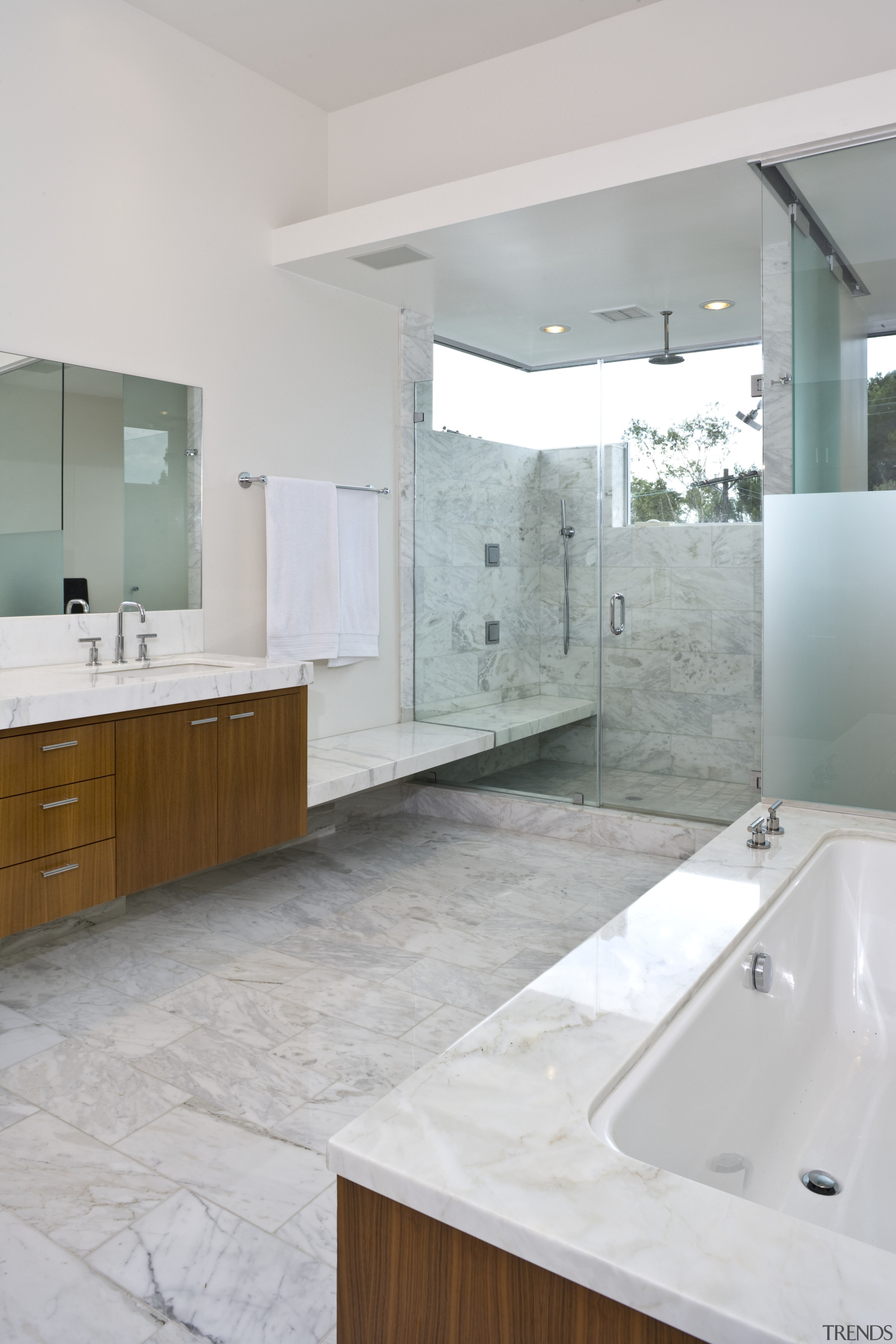 view of master bathroom which features bath tub, bathroom, bathroom accessory, bathroom cabinet, countertop, floor, home, interior design, room, sink, tap, tile, gray