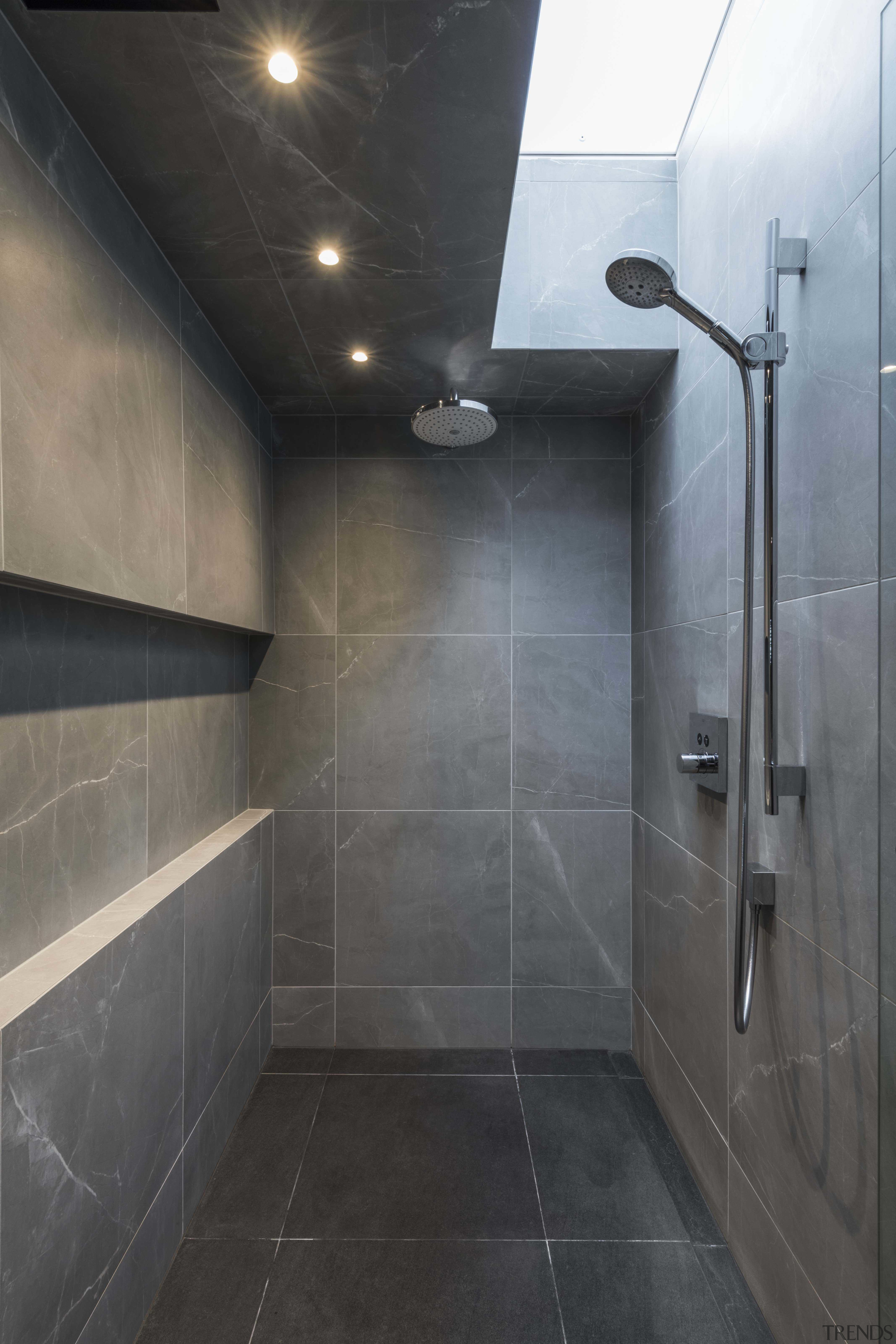 Bespoke cabinetry and spa-like bathing spaces for luxury architecture, bathroom, floor, flooring, plumbing fixture, room, shower, tile, black, gray