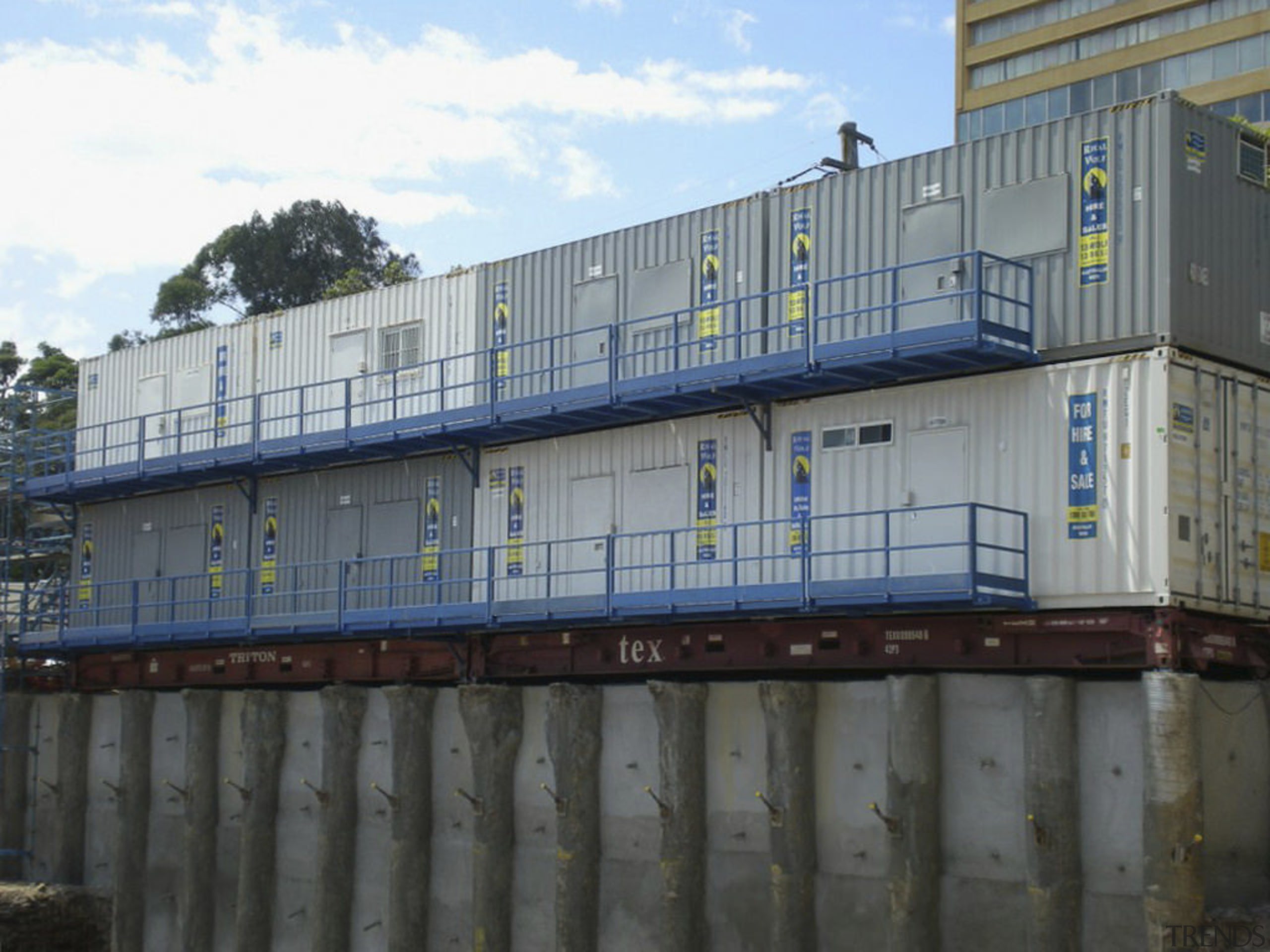 View of shipping containers from Royal Wolfe Australia. building, facade, freight transport, shed, shipping container, black, gray
