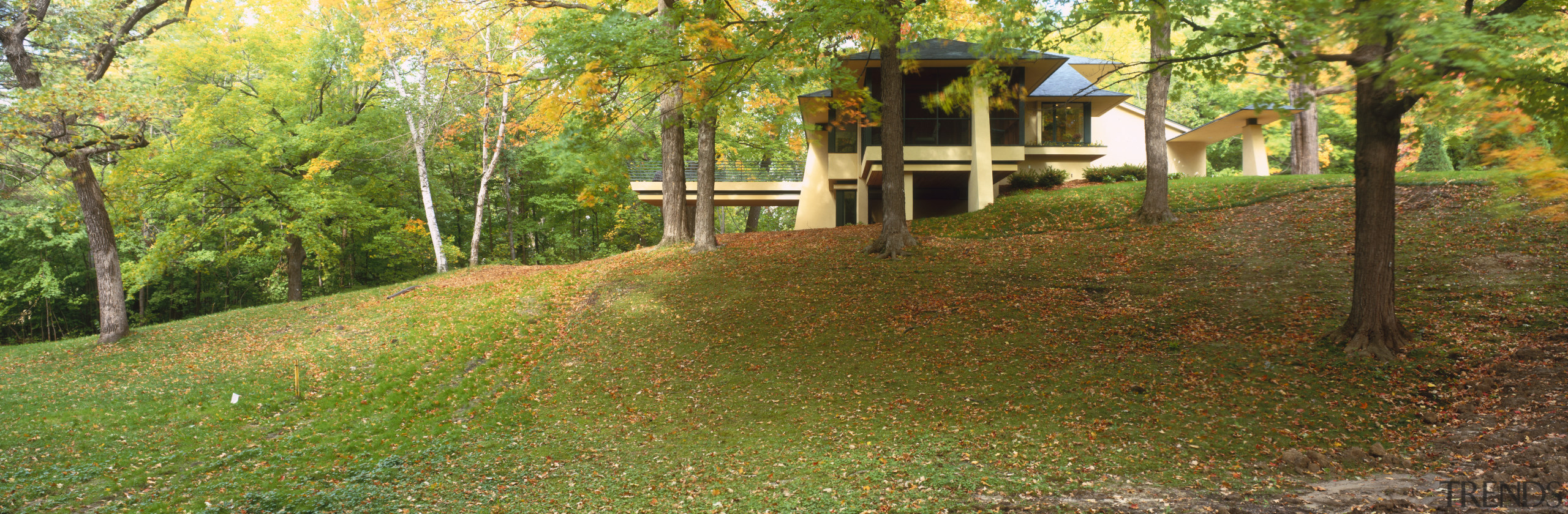 View of a house designed by Charles R autumn, biome, cottage, grass, house, land lot, landscape, lawn, leaf, nature reserve, path, property, real estate, state park, temperate broadleaf and mixed forest, tree, woodland, brown, green