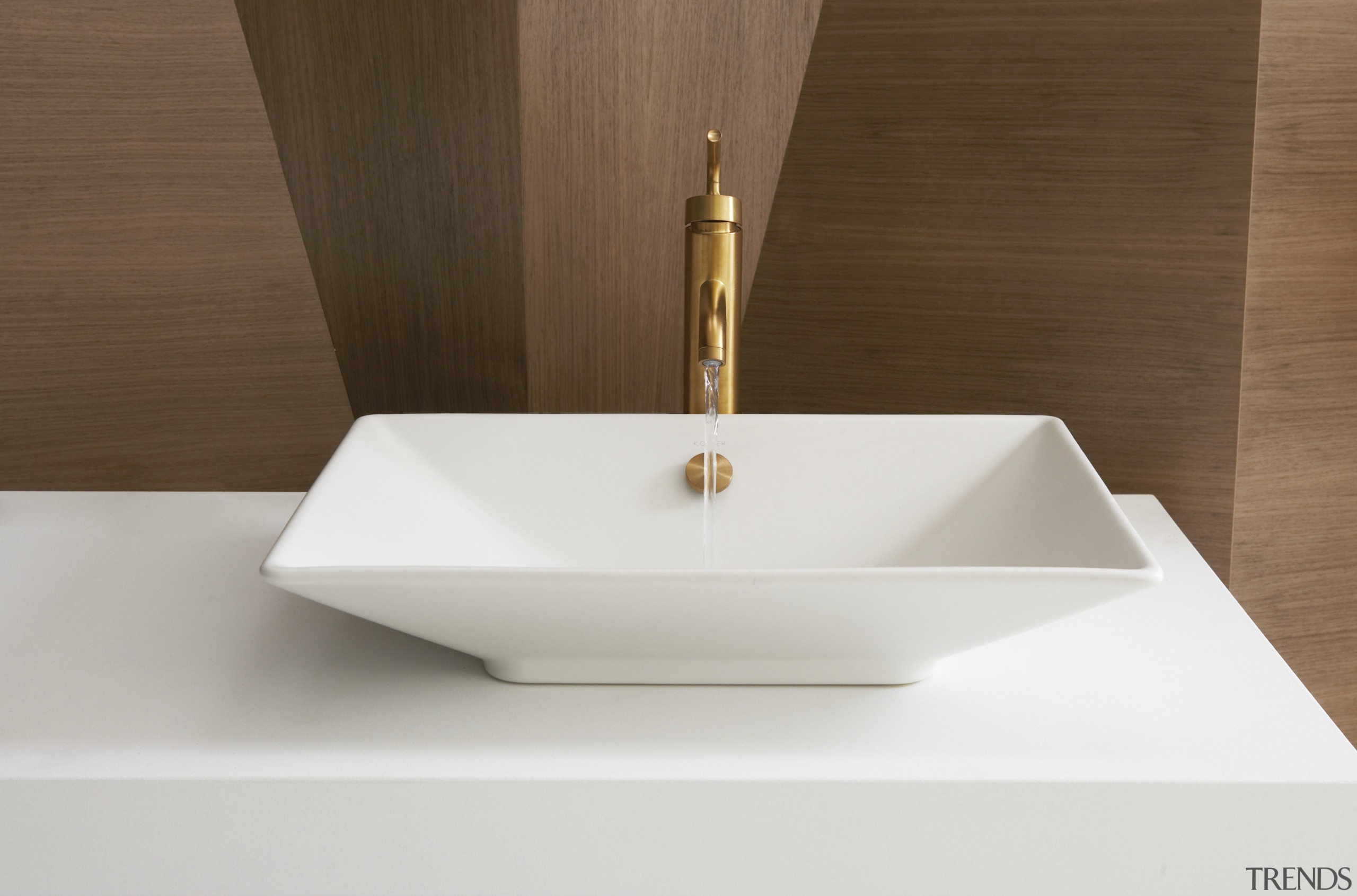 View of a Kohler basin with gold faucets bathroom sink, ceramic, plumbing fixture, product design, sink, tap, brown, white
