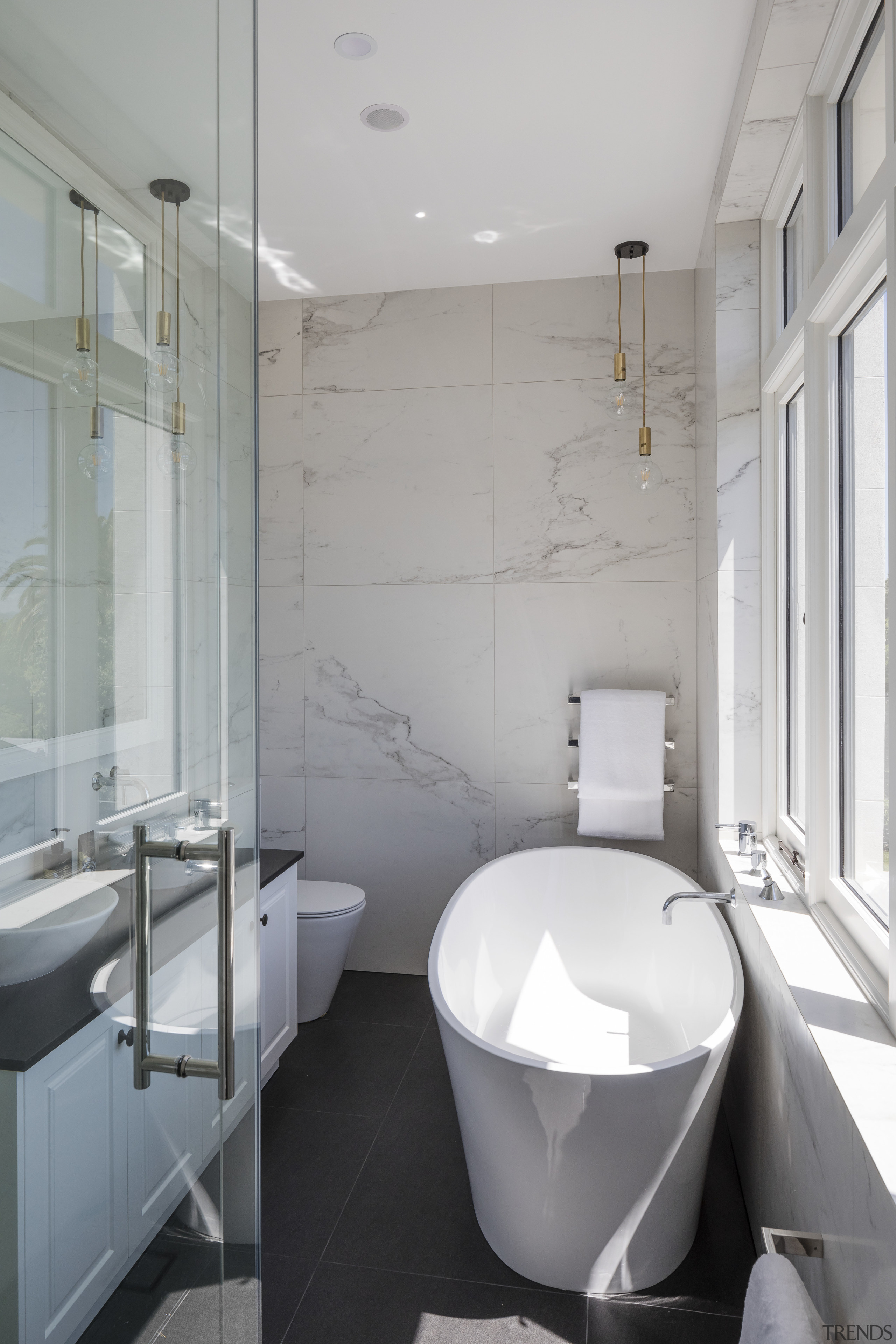 Glass and marble-look surfaces feature in the modern architecture, bathroom, floor, home, interior design, plumbing fixture, product design, room, tap, tile, gray
