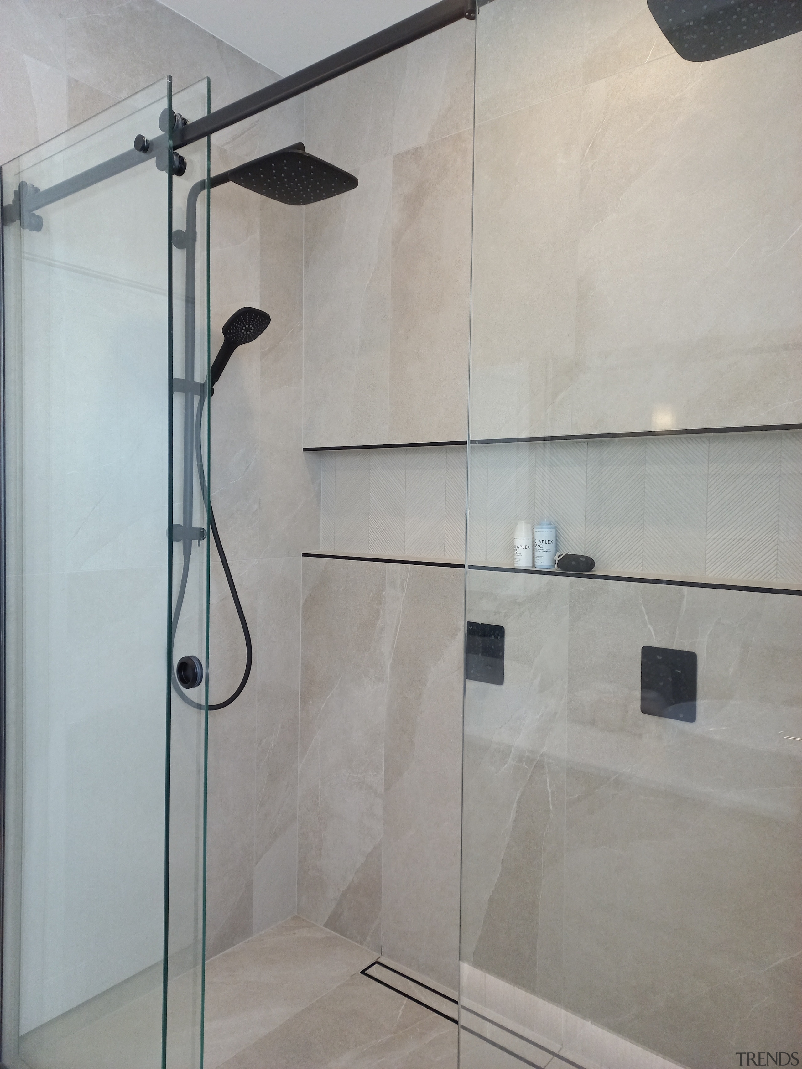 Black fittings set off the shower enclosure. 