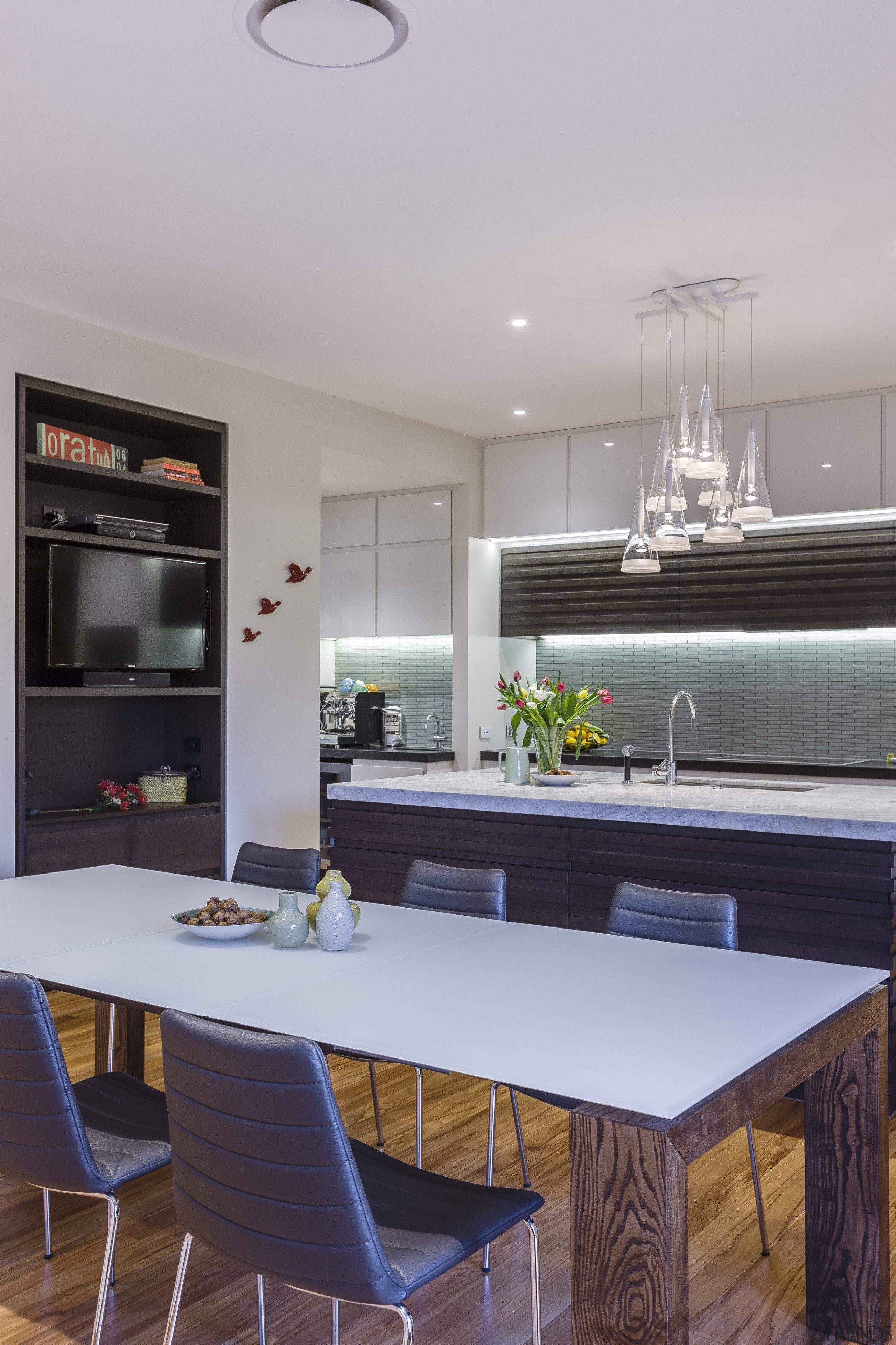 The use of wood in this kitchen by countertop, interior design, kitchen, room, gray