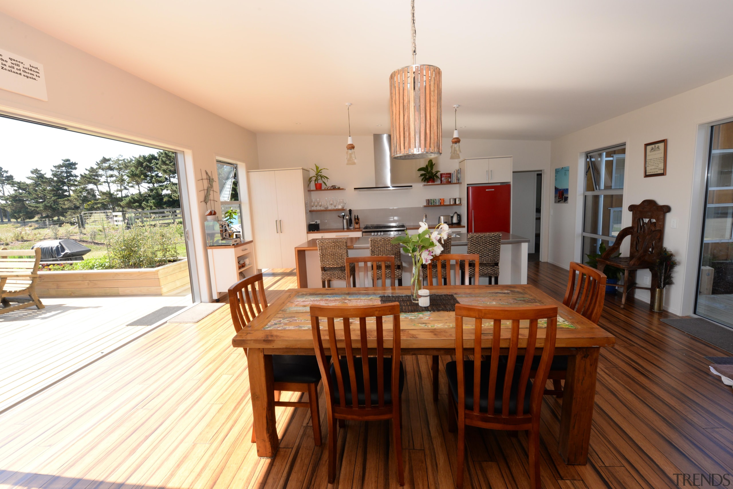 Open plan kitchen area with indoor / outdoor dining room, hardwood, house, interior design, property, real estate, room, table, white