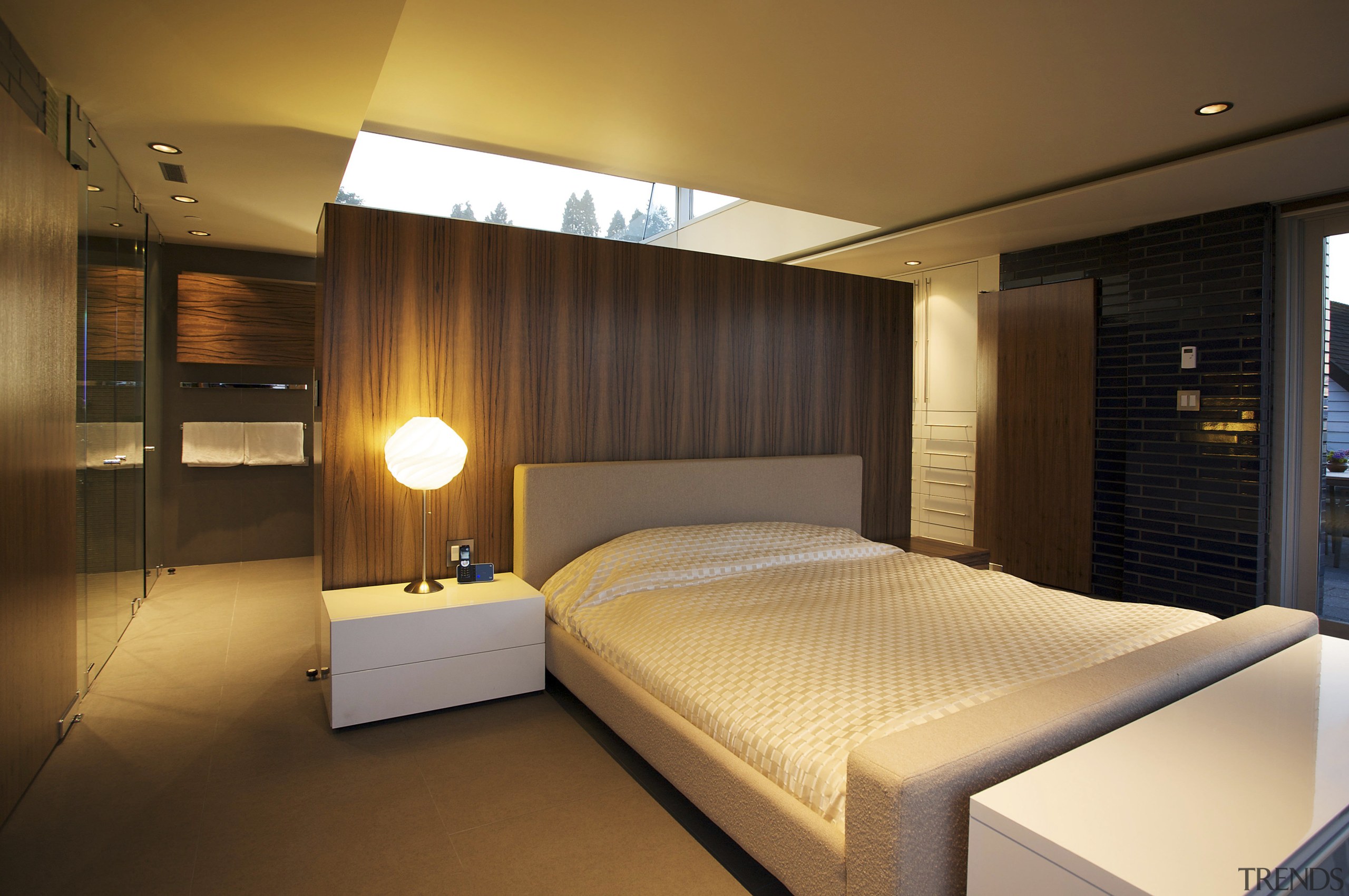 In this new master suite, storage and closet bedroom, ceiling, interior design, lighting, room, suite, brown