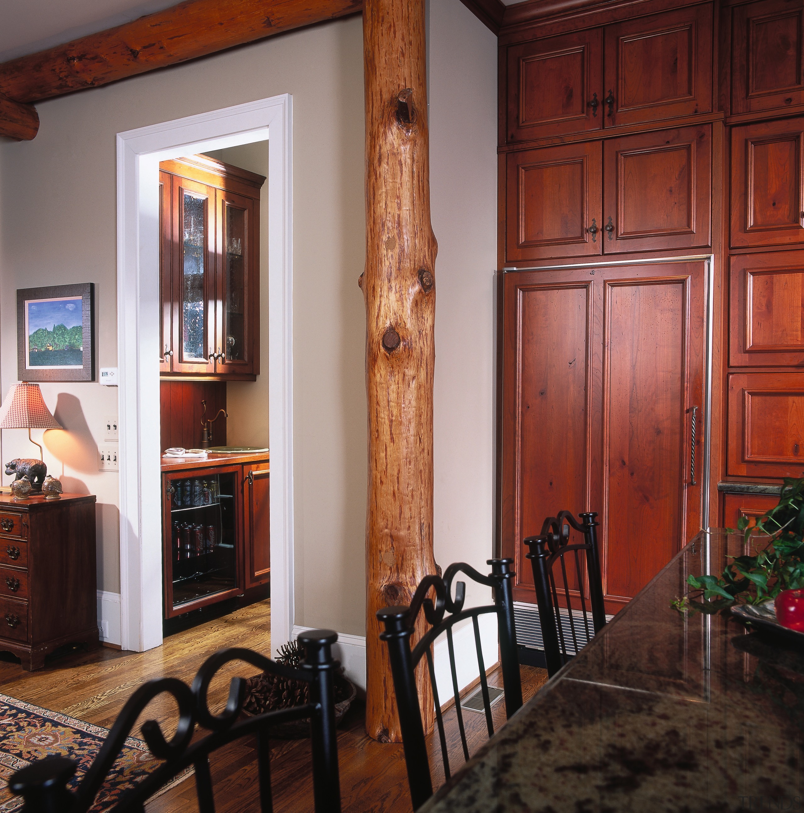 A view of the kitchen area, wooden flooring cabinetry, ceiling, dining room, door, flooring, furniture, hardwood, home, house, interior design, living room, room, wall, window, wood, wood stain, red