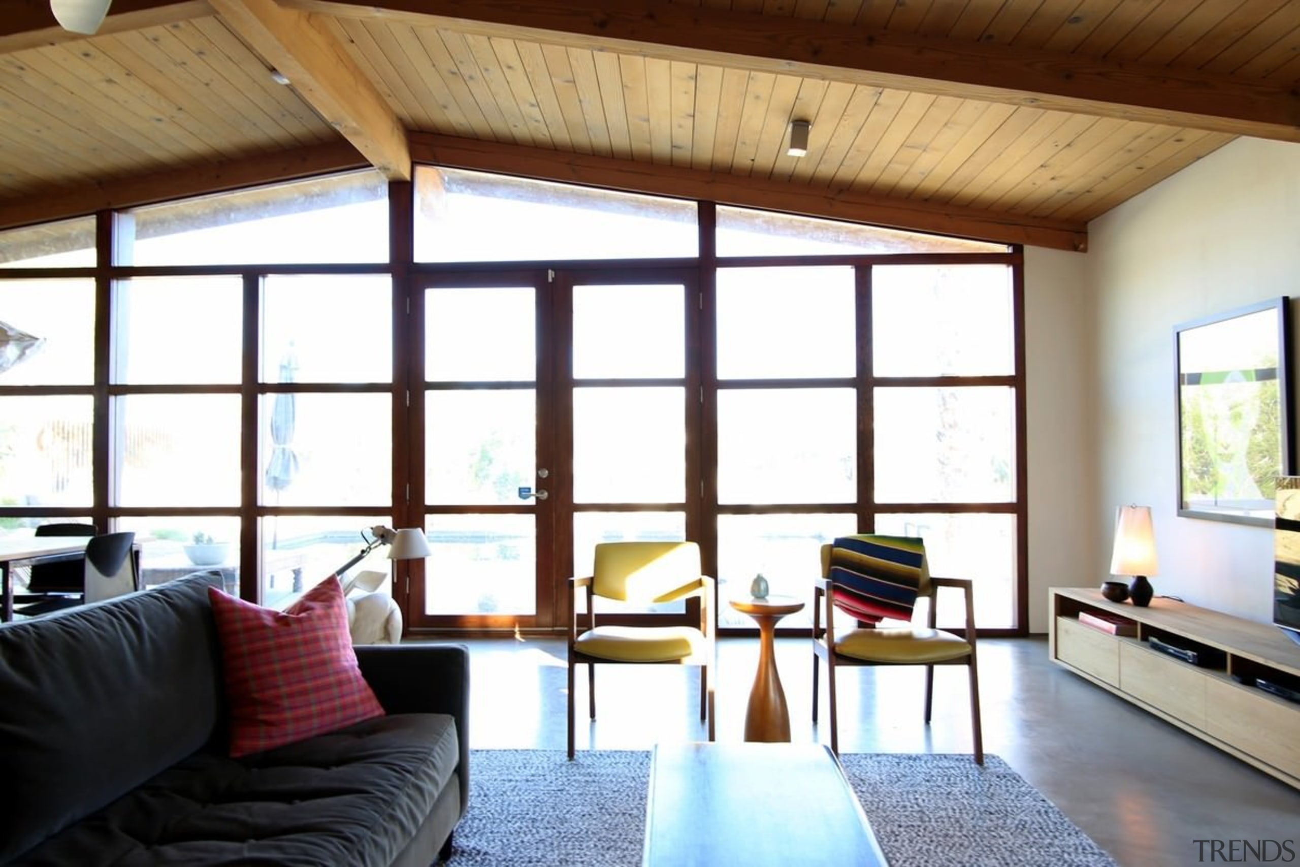 The pitched ceiling makes the lounge a spacious, architecture, ceiling, daylighting, house, interior design, living room, real estate, room, window, wood, white