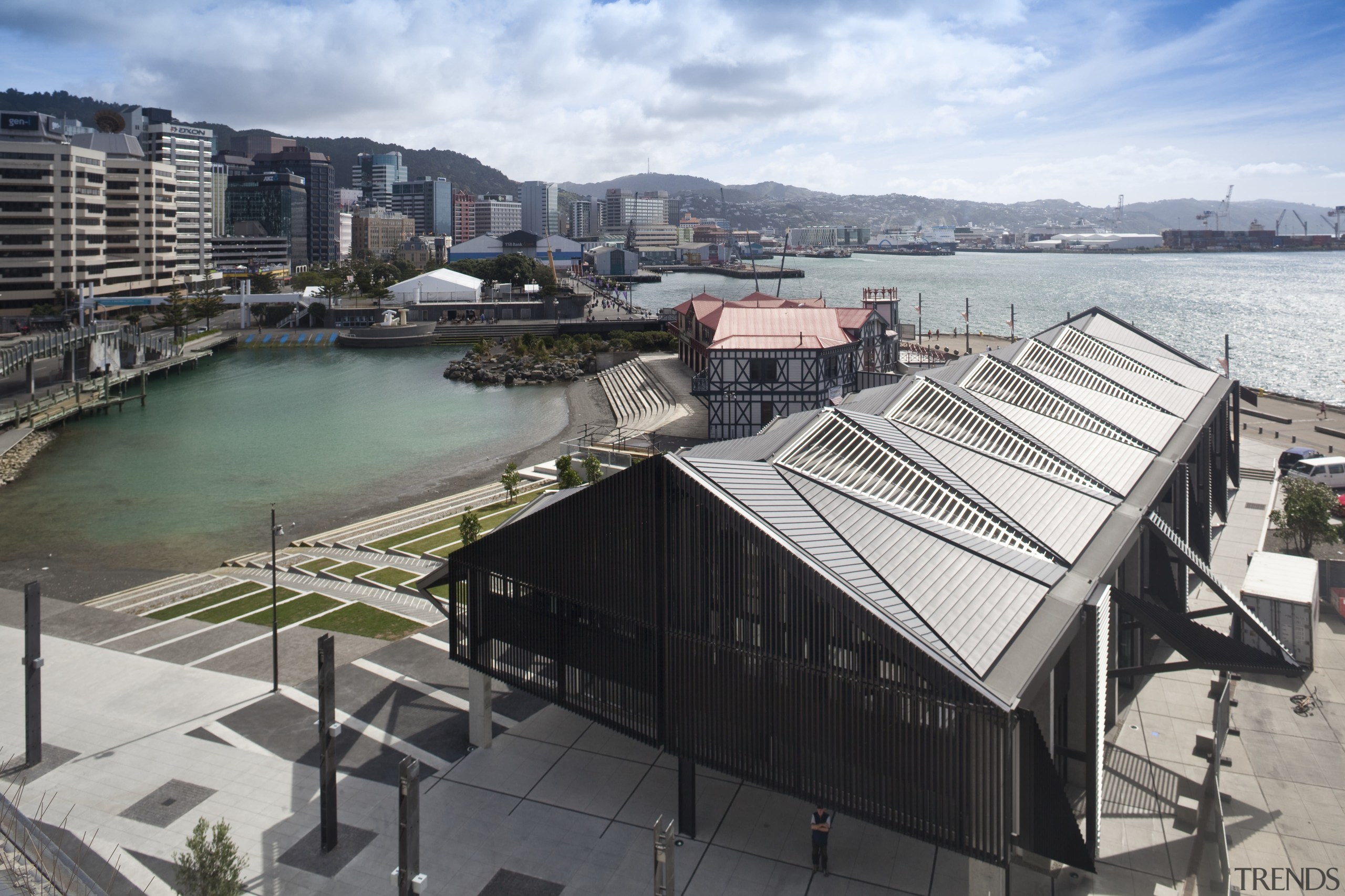 View of the Wharewaka building and event centre building, city, condominium, real estate, roof, sky, urban area, water, gray, black