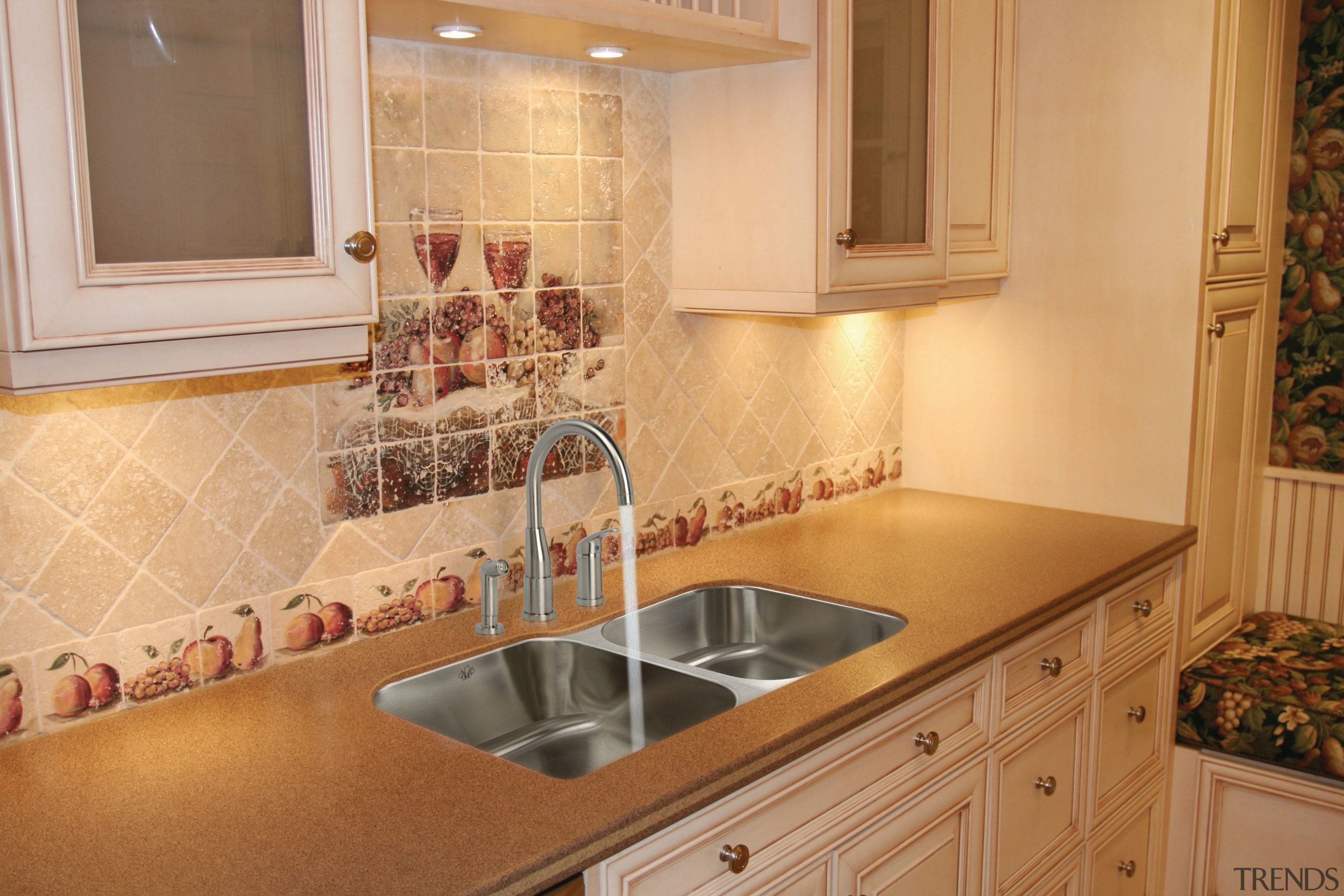 View of kitchen which features sink and arched cabinetry, countertop, floor, flooring, home, interior design, kitchen, property, room, sink, tile, under cabinet lighting, orange, brown