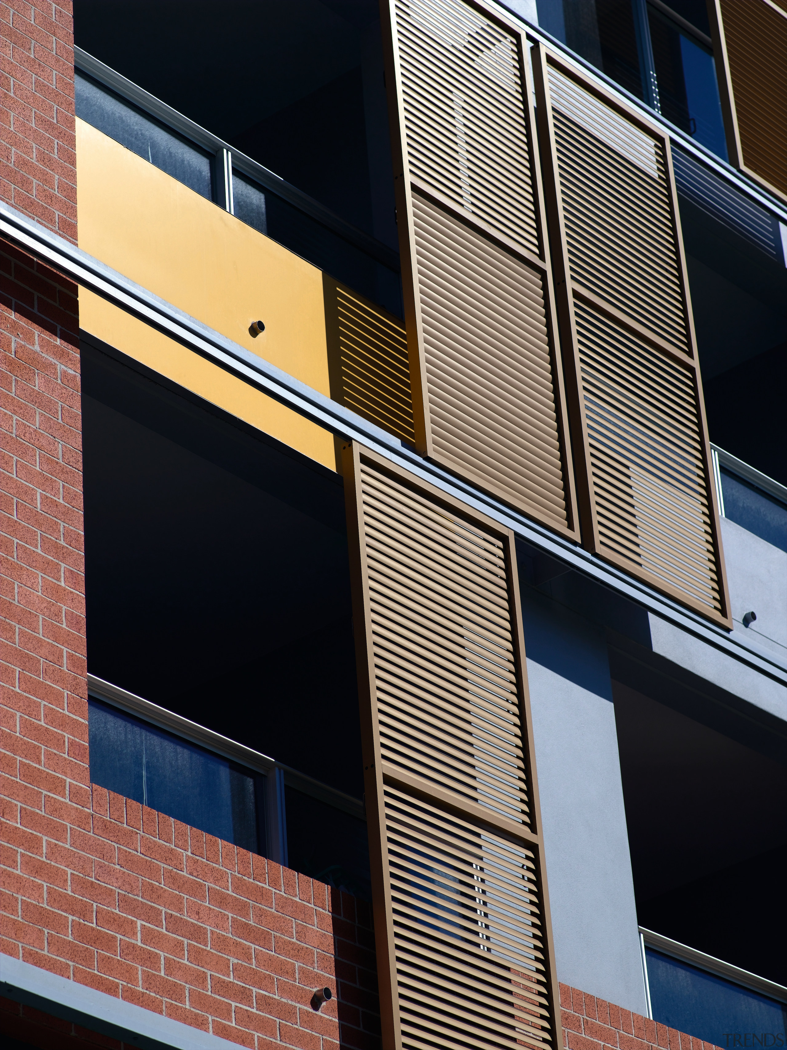 An exterior view of the discovery point apartment angle, architecture, brick, building, commercial building, daylighting, daytime, facade, glass, house, line, metropolitan area, residential area, sky, urban area, wall, window, black