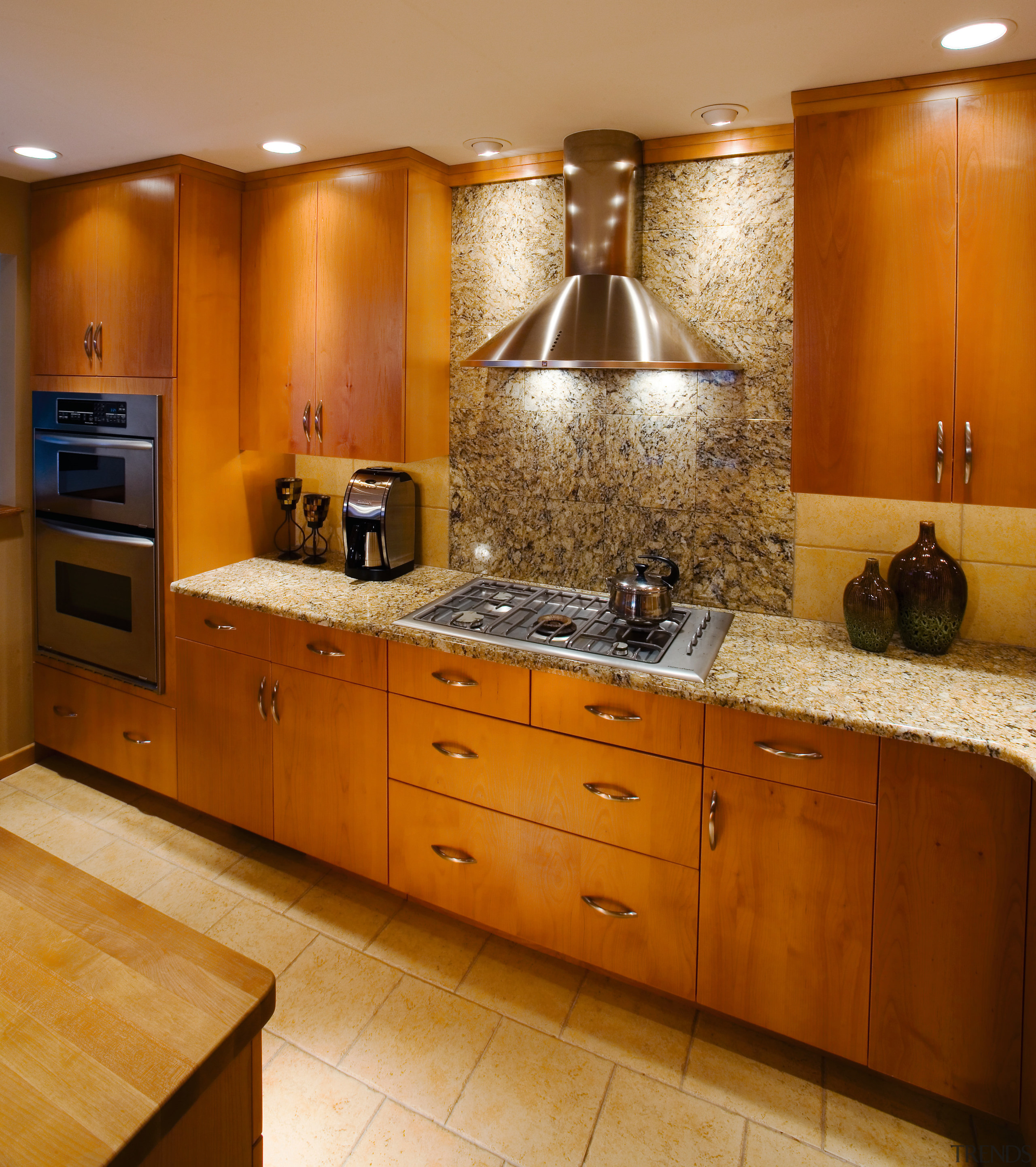 A view of frameless cabinets in alder, with cabinetry, countertop, cuisine classique, flooring, interior design, kitchen, room, under cabinet lighting, brown, orange