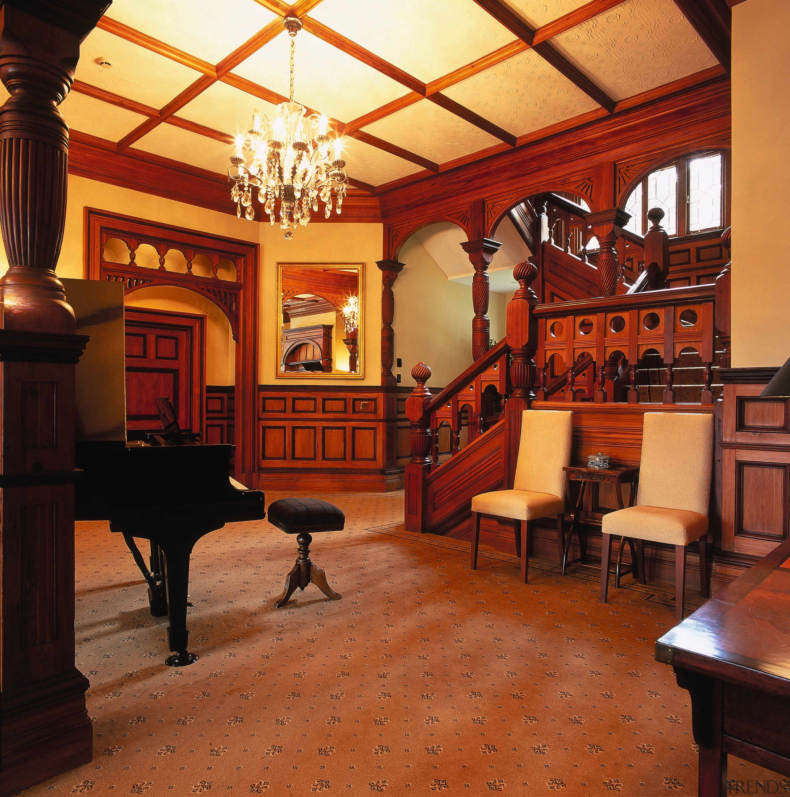 The view of an entrance hall of a ceiling, estate, flooring, furniture, interior design, lobby, real estate, table, wood, red, orange