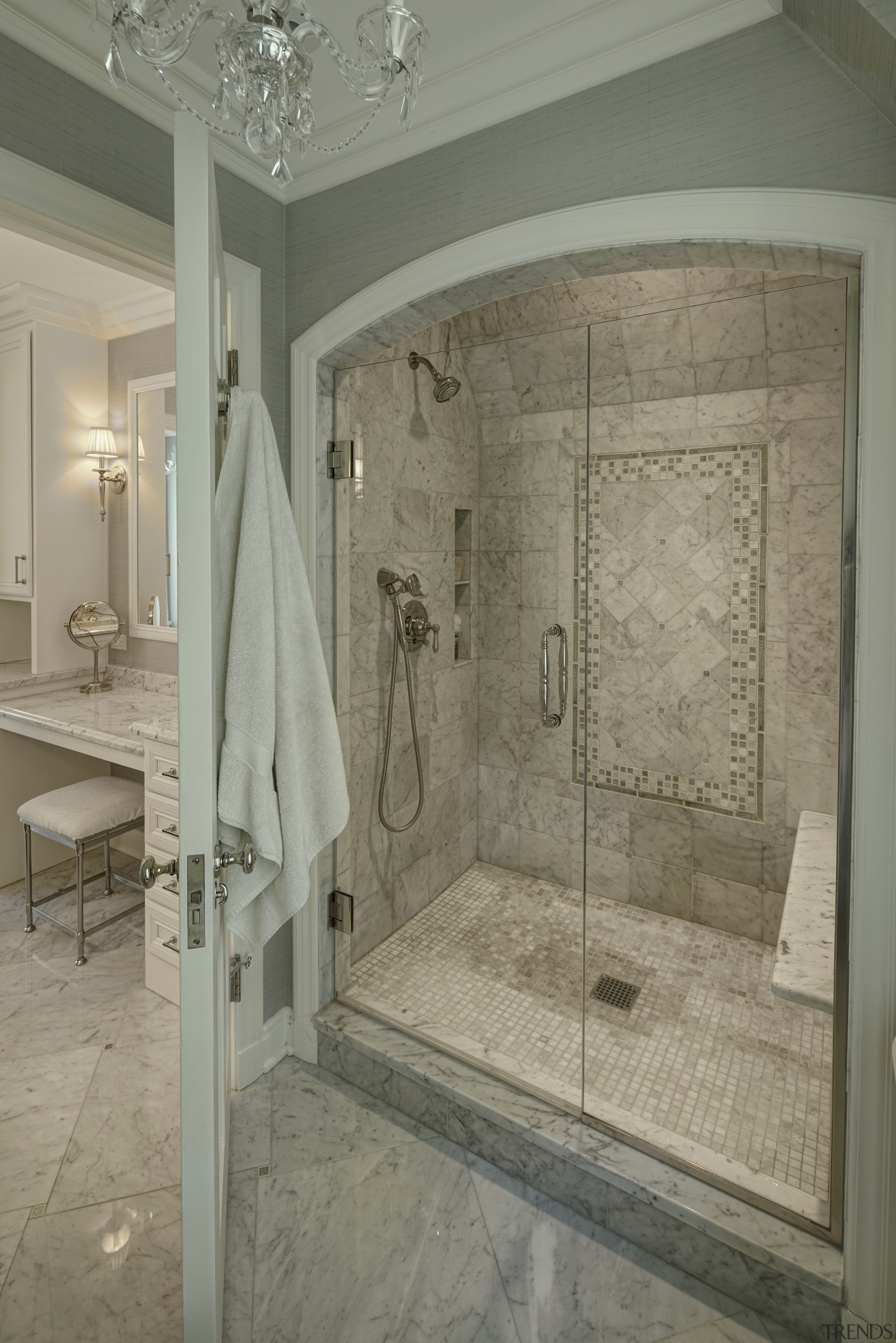 In this remodel by architect Scott Javore a bathroom, ceiling, floor, flooring, home, interior design, plumbing fixture, room, tile, wall, gray, brown