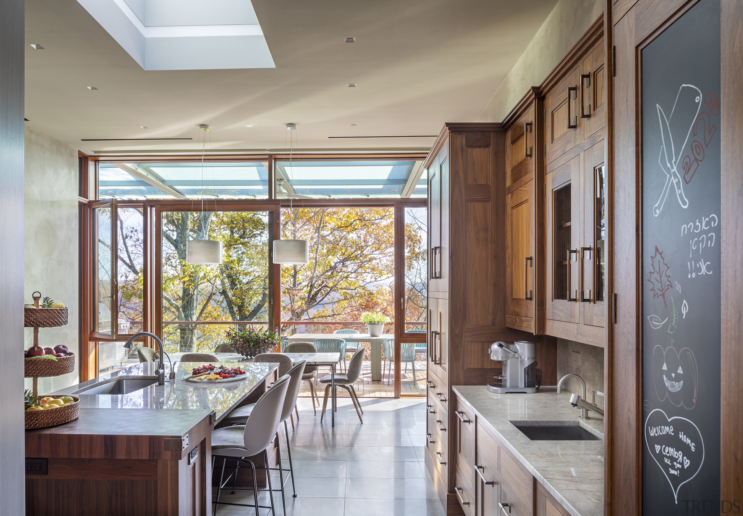 The first level kitchen in appropriate wood-finished cabinetry. 