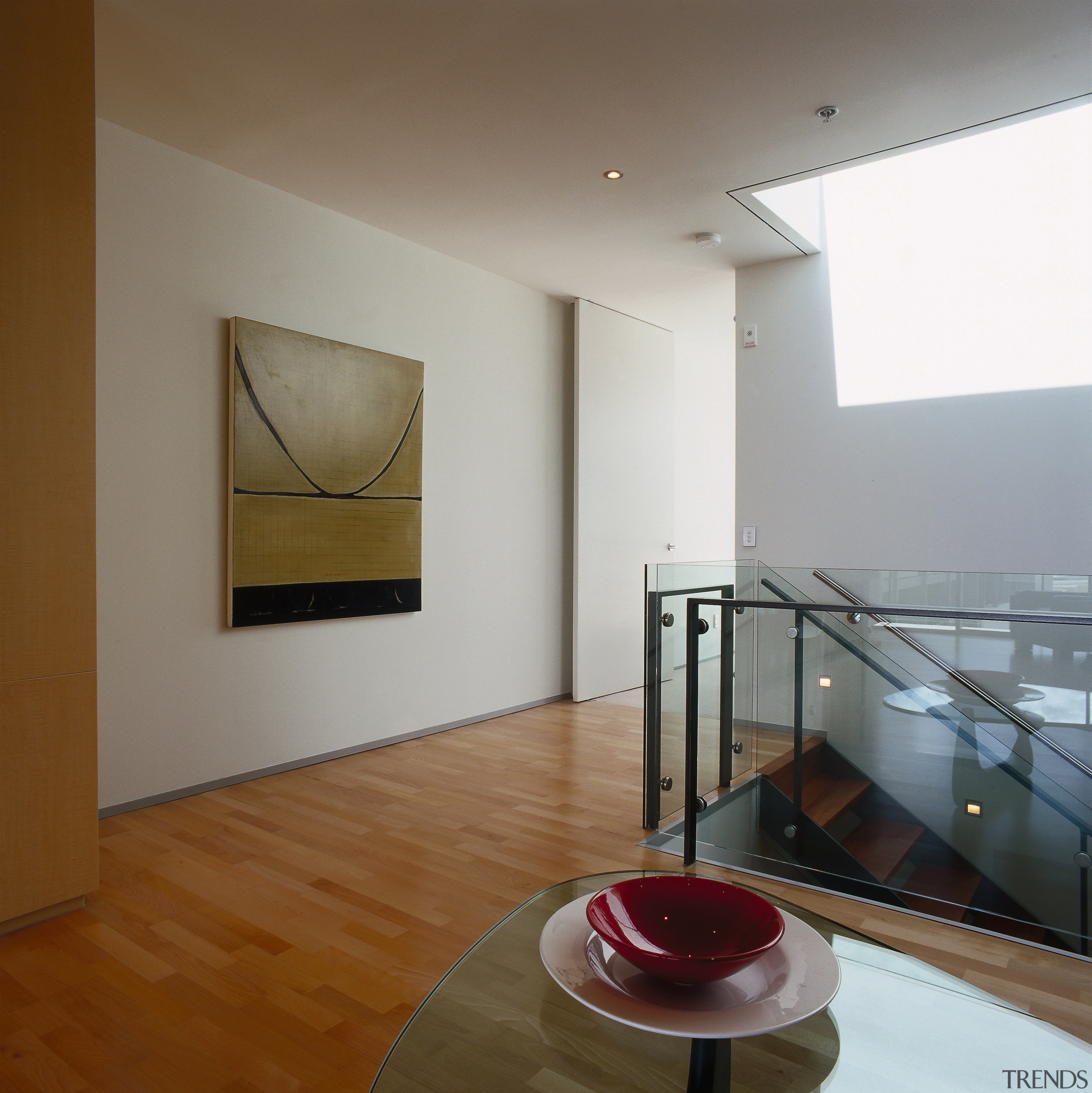Area at top of stairway with glass balustrades, apartment, architecture, ceiling, daylighting, floor, flooring, home, house, interior design, loft, room, table, gray, brown