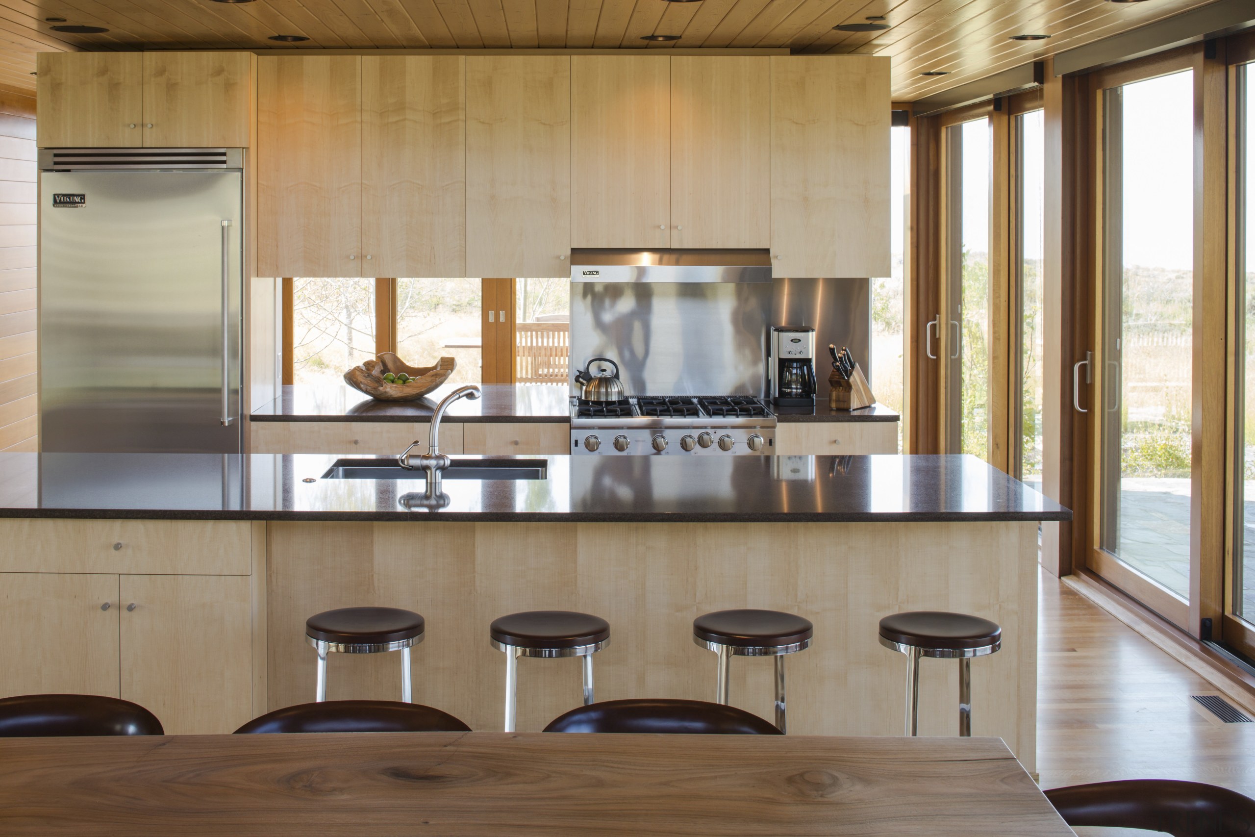 The kitchen in this rural holiday home features cabinetry, countertop, cuisine classique, interior design, kitchen, wood, brown, gray