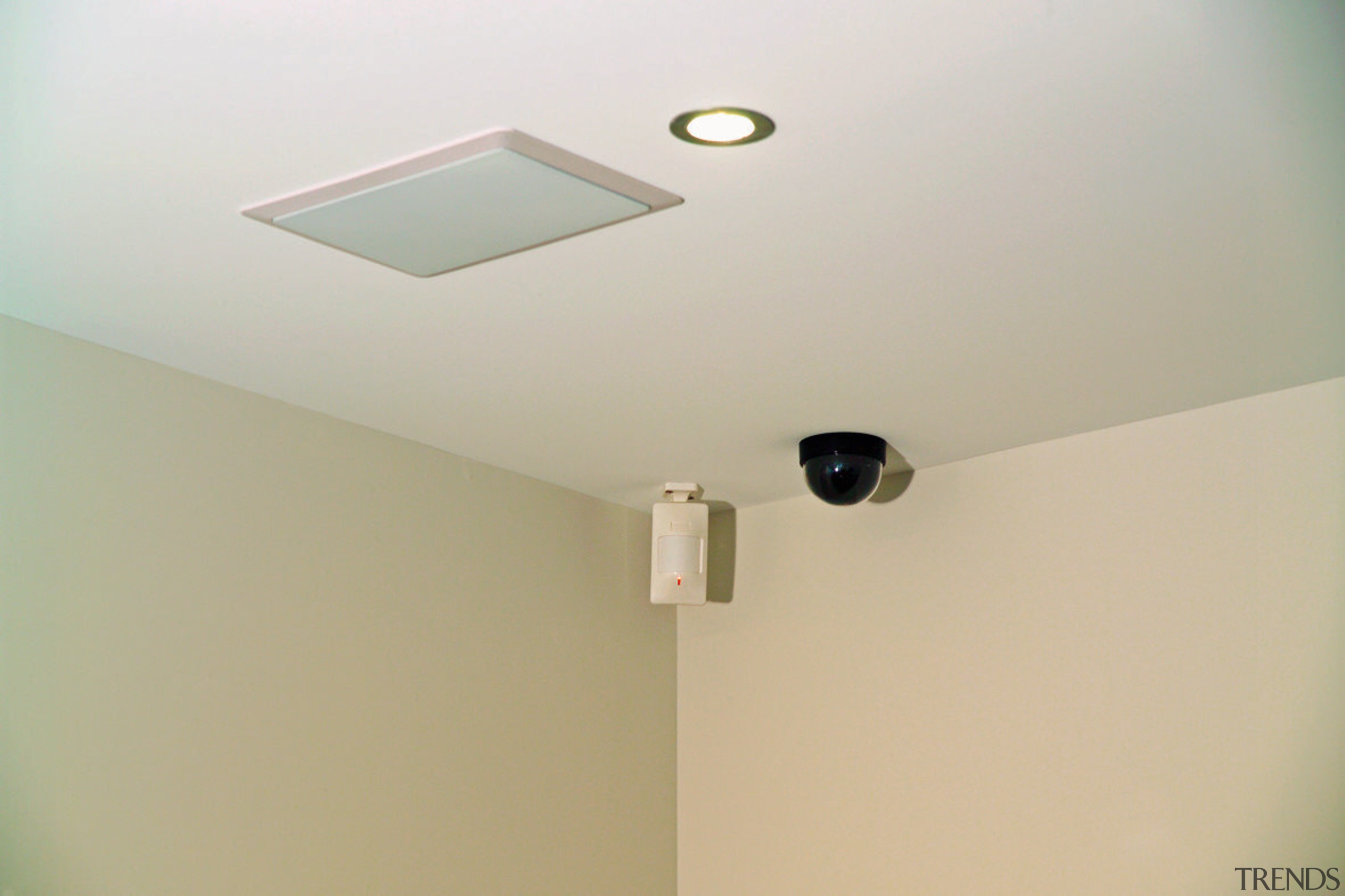 Ceiling with security camera detector and speaker. ceiling, daylighting, light fixture, lighting, plaster, product design, wall, gray