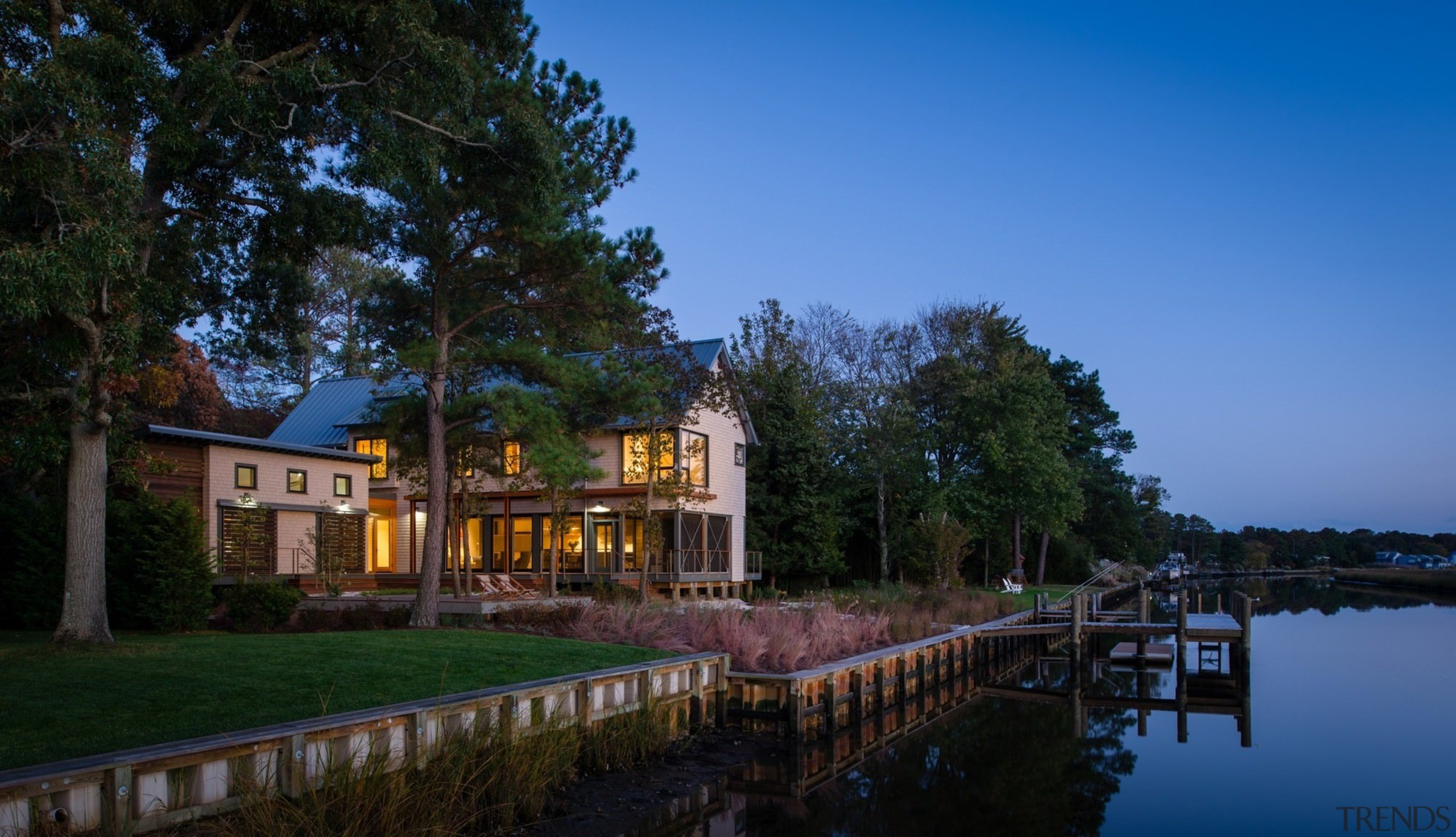 This home sits on the edge of a bayou, canal, cottage, estate, evening, home, house, lake, mansion, nature, plant, property, real estate, reflection, river, sky, tree, villa, water, waterway, black, blue