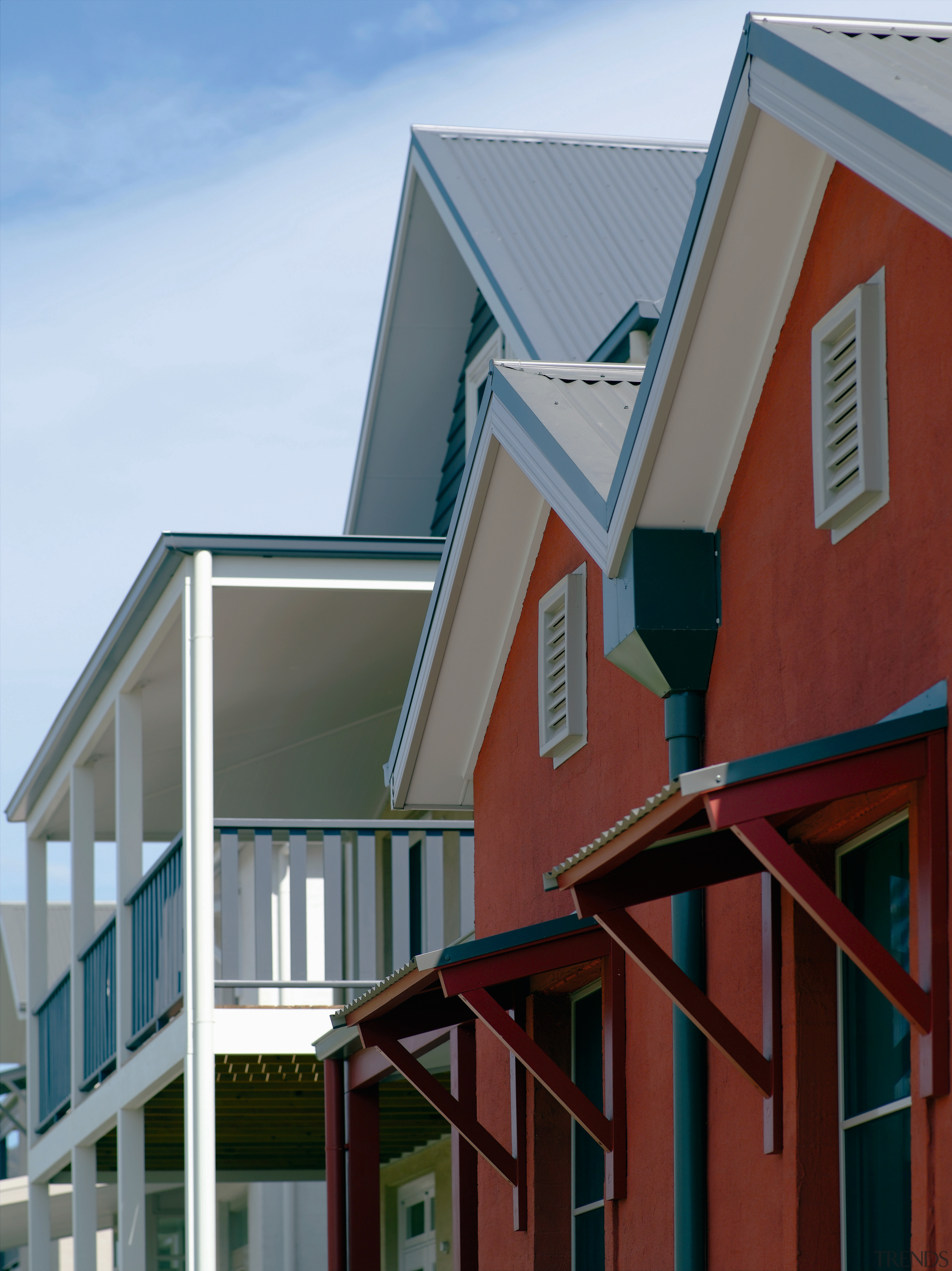 Authentic detailing on the architecture is matched by architecture, balcony, building, elevation, facade, home, house, real estate, residential area, roof, siding, sky, window, gray, red