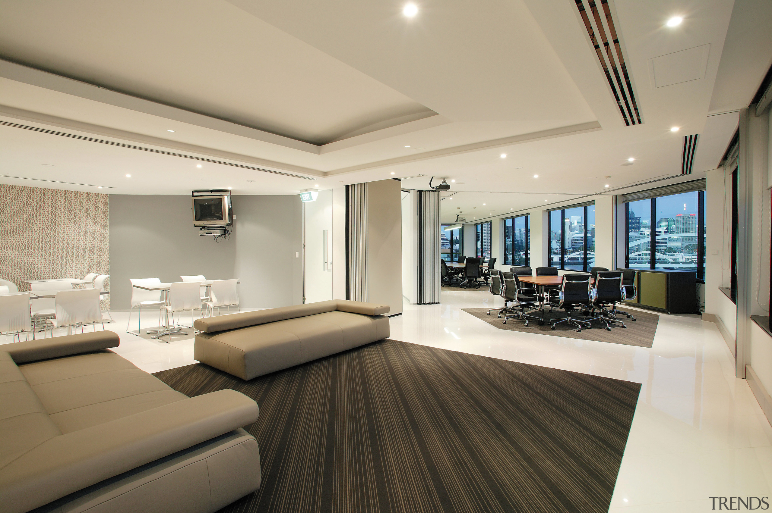 view of the breakput area featuring couches, tables ceiling, floor, flooring, interior design, living room, penthouse apartment, real estate, room, orange