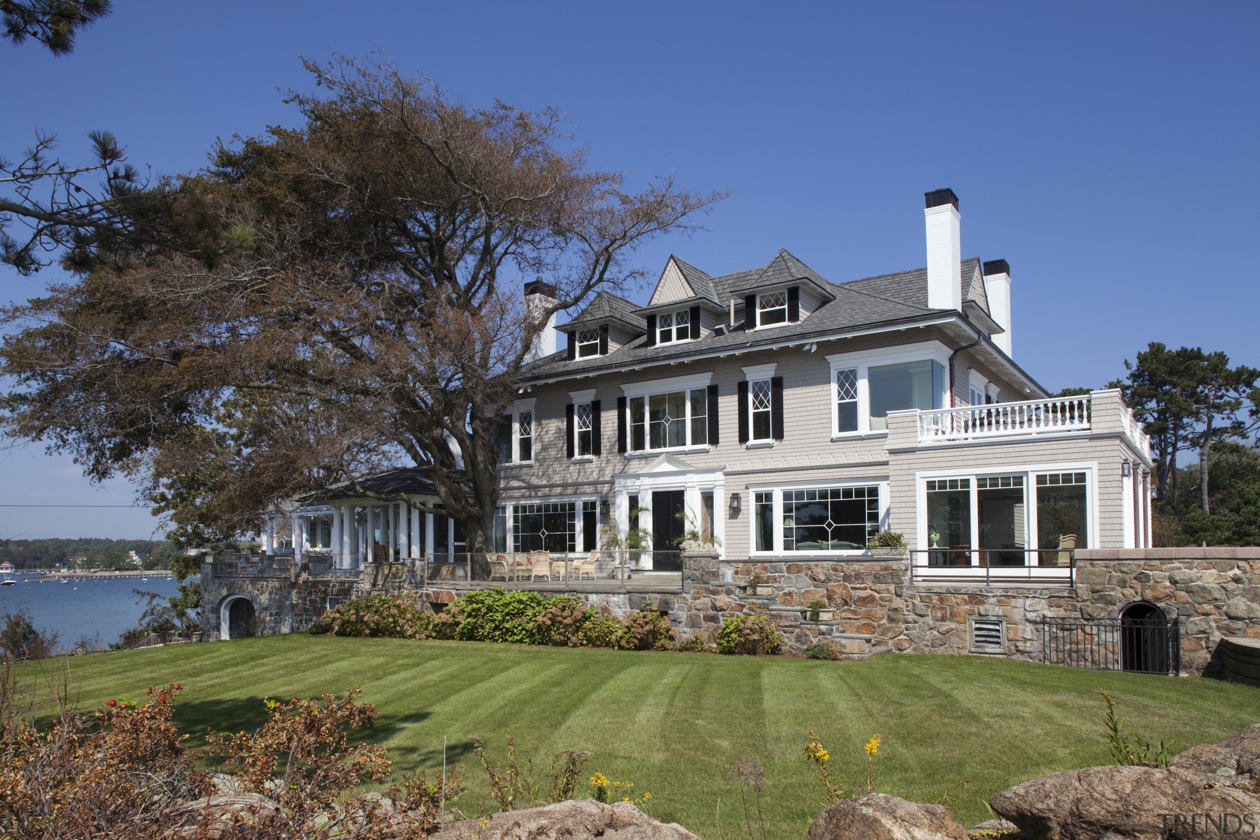 On the coastal side of this remodeled home, cottage, estate, facade, farmhouse, historic house, home, house, landscape, mansion, plantation, property, real estate, siding, villa, window, blue