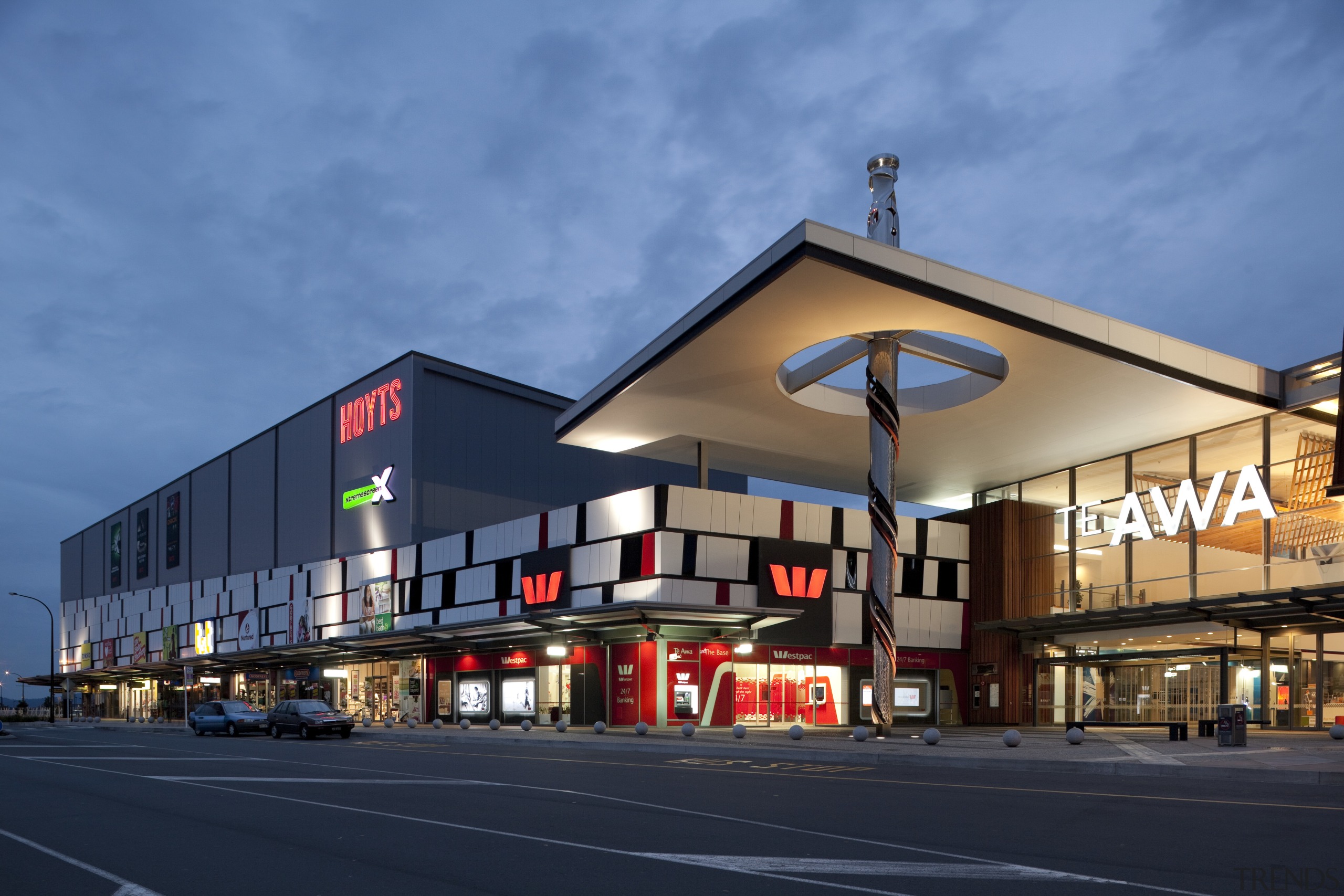 Exterior view of mall at dusk. - Exterior architecture, building, commercial building, corporate headquarters, facade, mixed use, real estate, residential area, sky, structure, teal, blue