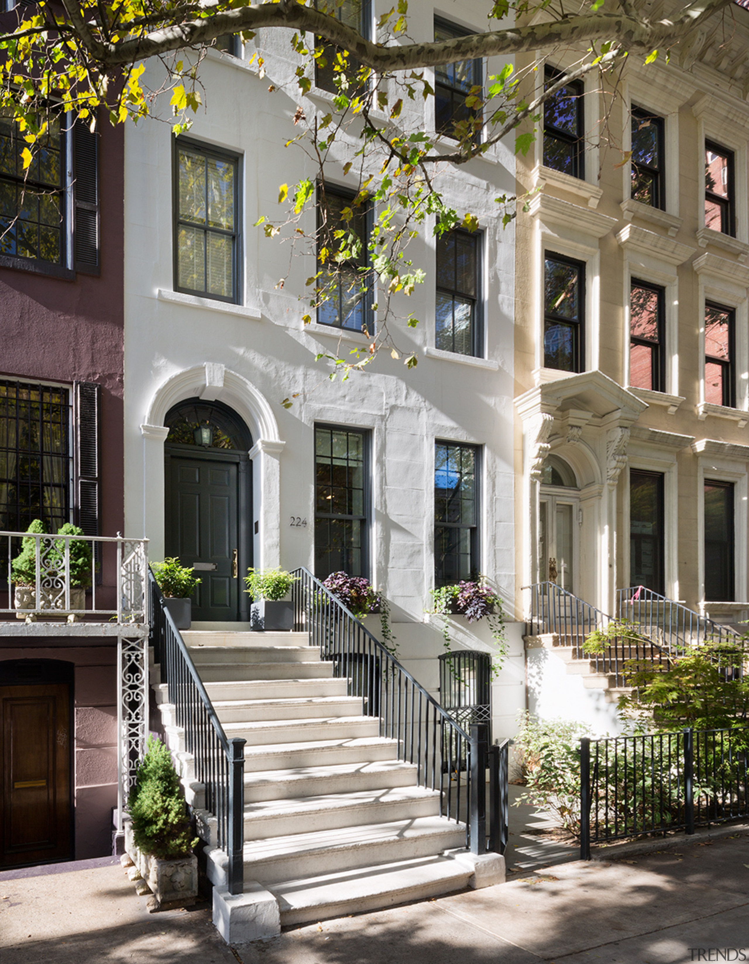 This 1874 four-storey townhouse located in the middle apartment, architecture, building, courtyard, estate, facade, home, house, mixed use, neighbourhood, outdoor structure, porch, property, real estate, residential area, gray