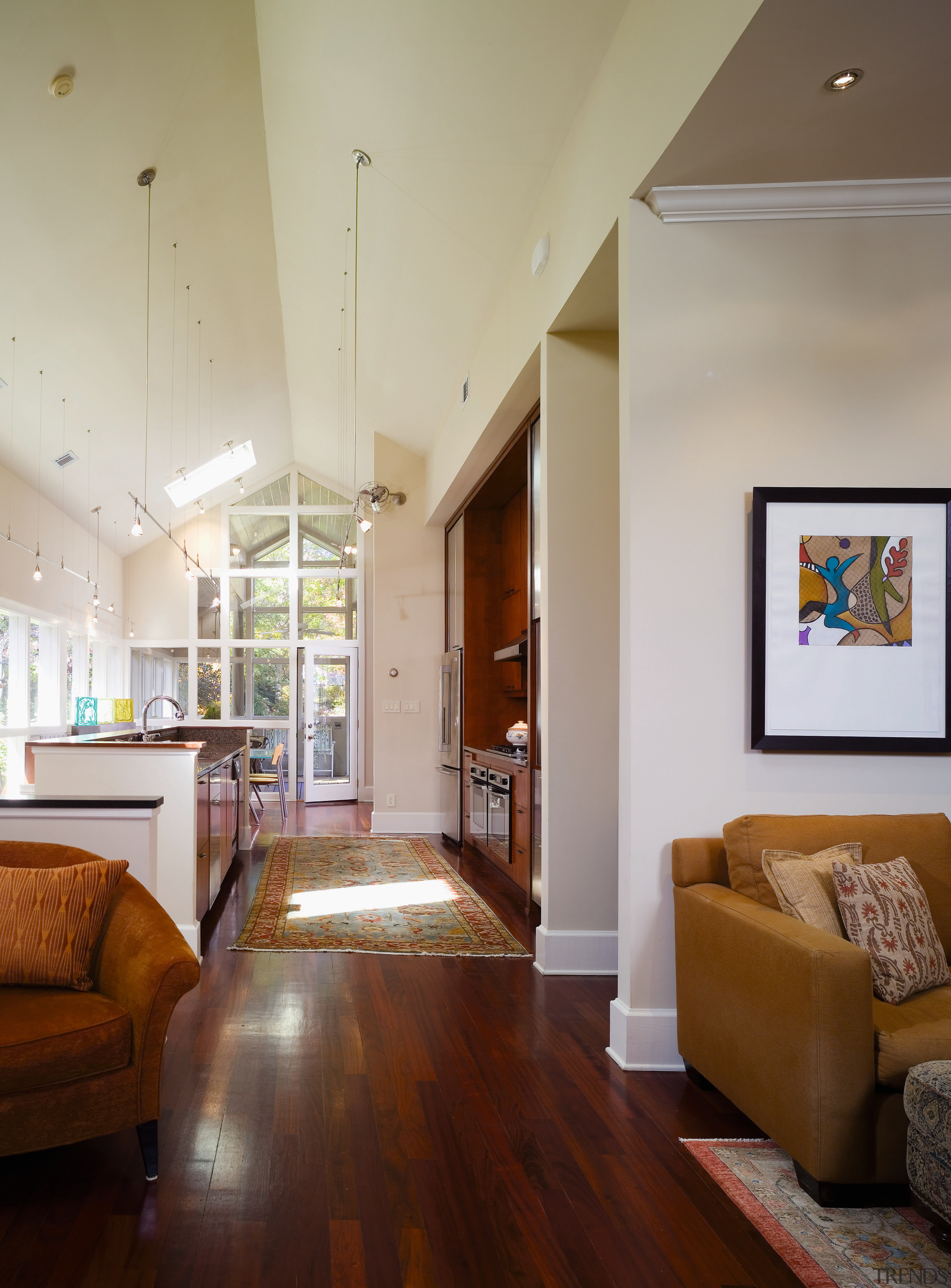 A view of the living areas in this ceiling, daylighting, floor, flooring, hardwood, home, house, interior design, laminate flooring, living room, real estate, room, wall, wood, wood flooring, gray, brown