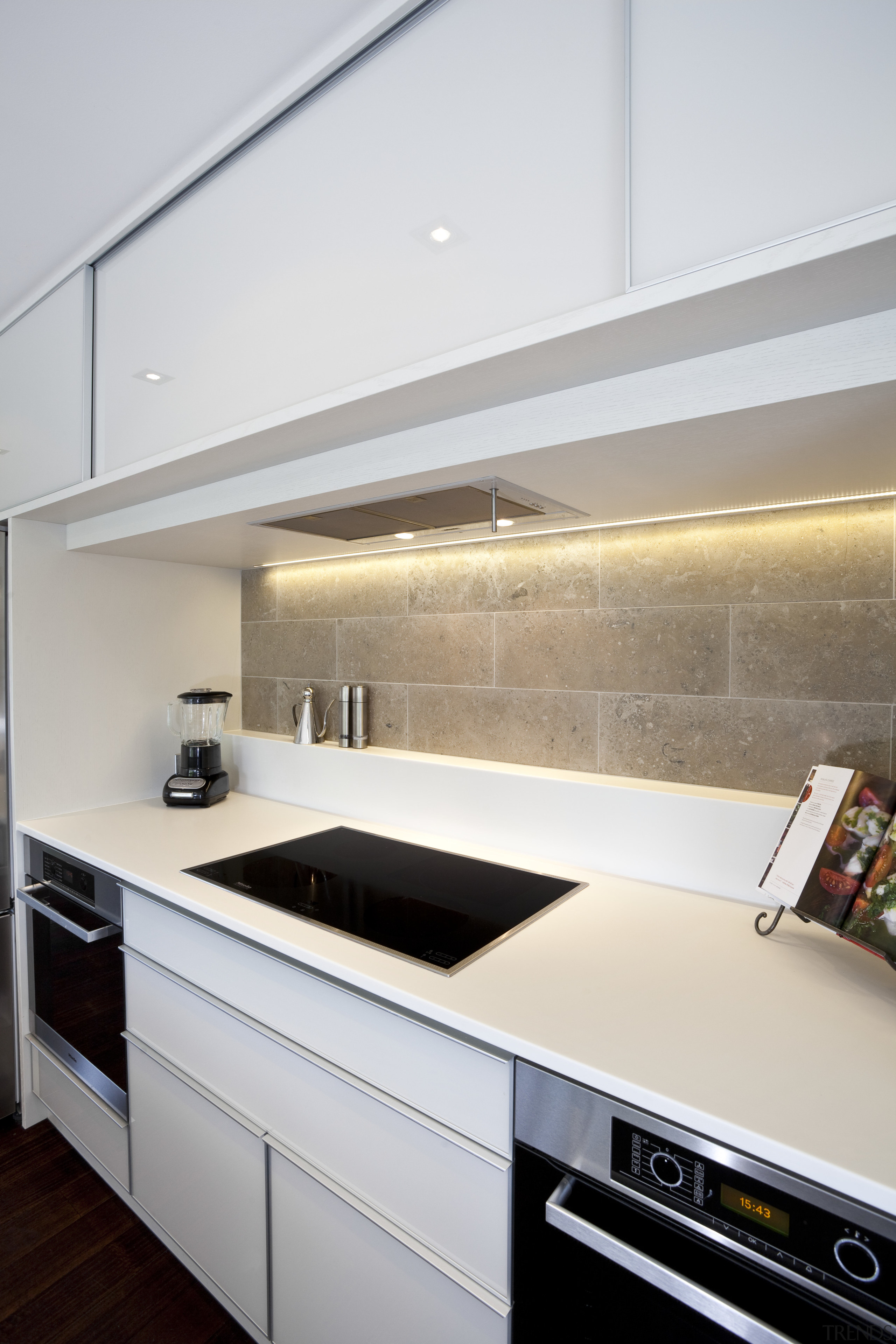 View of contemporary kitchen with white cabinetry, wooden cabinetry, countertop, interior design, kitchen, room, under cabinet lighting, white, gray