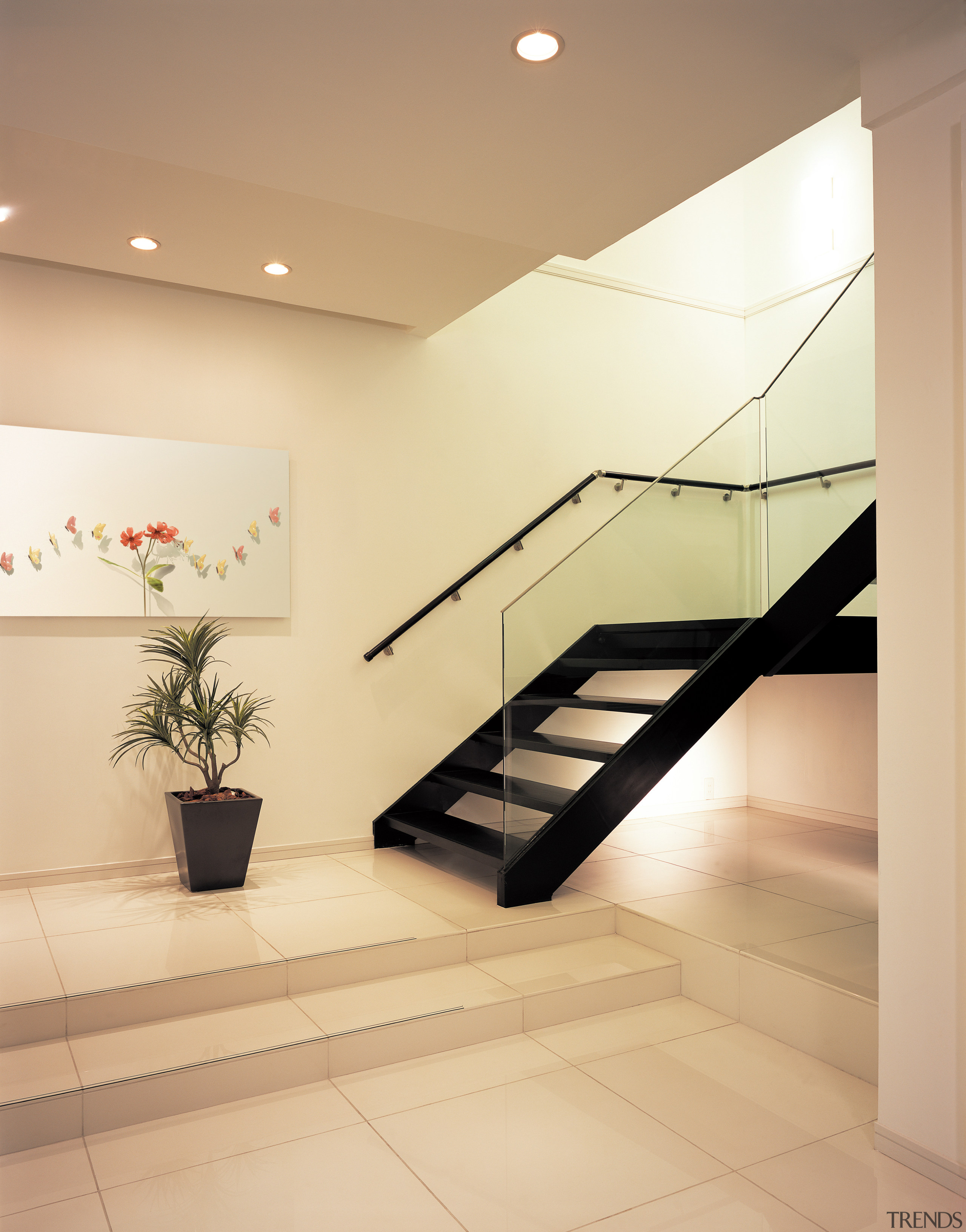 A window in the void of the stairwell architecture, ceiling, daylighting, floor, flooring, glass, handrail, interior design, lobby, product design, real estate, stairs, tile, orange