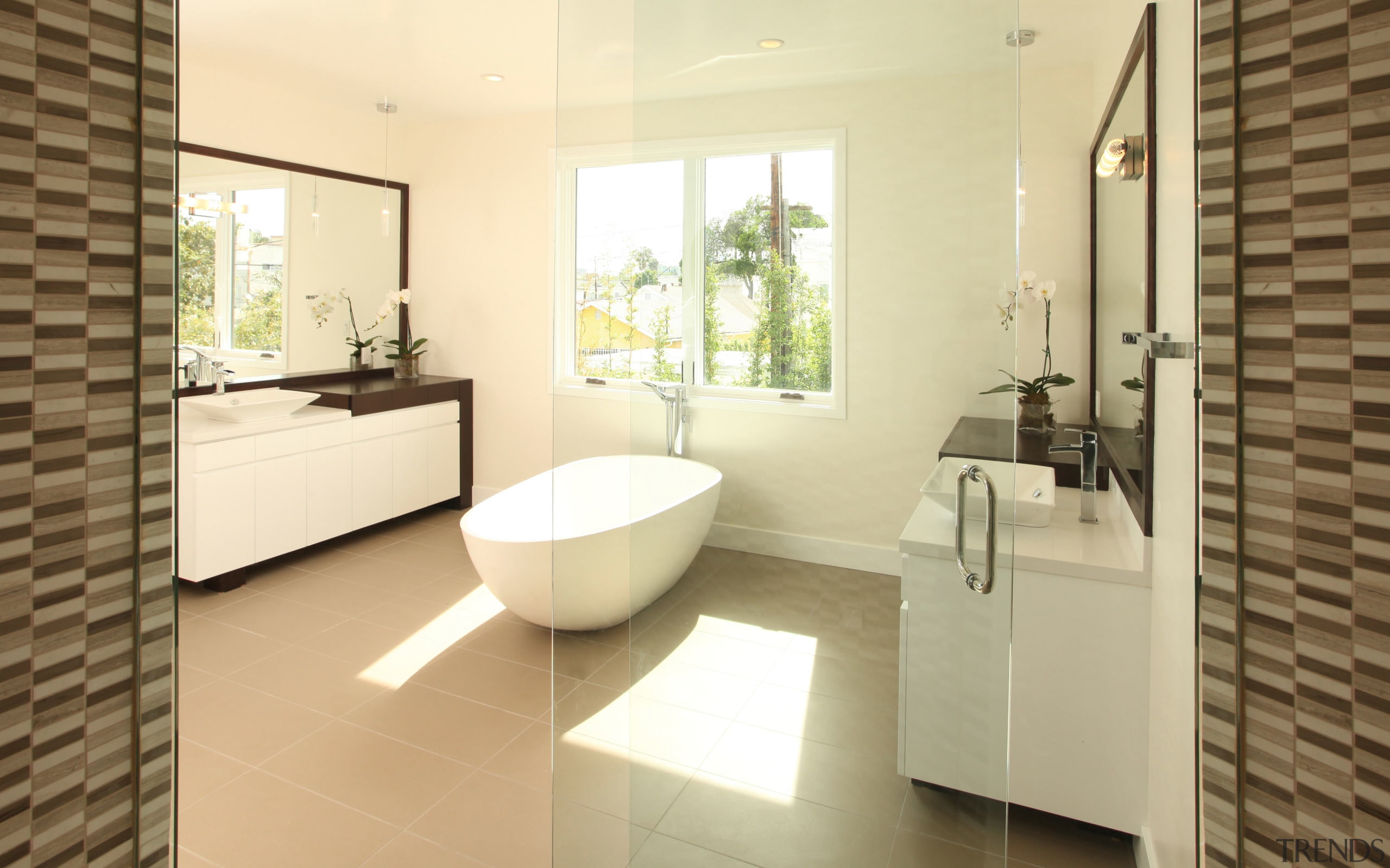 A freestanding soaking tub divides this master bathroom bathroom, estate, floor, flooring, home, interior design, property, real estate, room, tile, yellow, brown