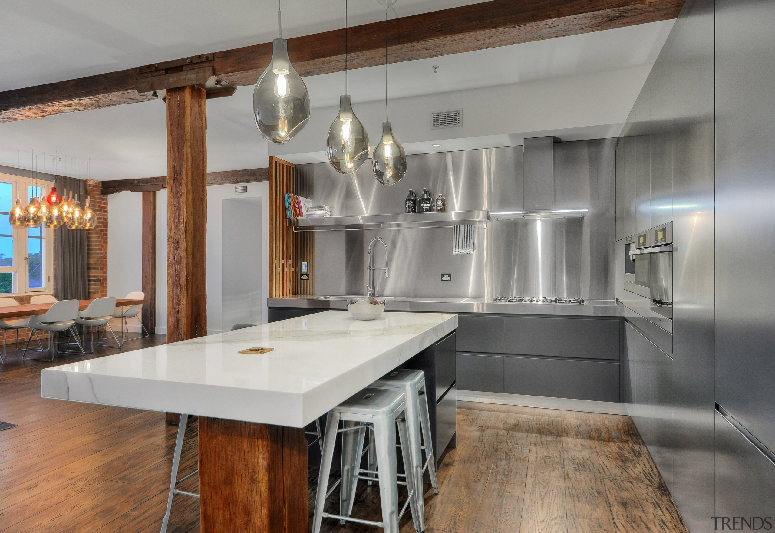 The charcoal lacquer kitchen cabinetry in this loft countertop, cuisine classique, interior design, kitchen, loft, real estate, gray