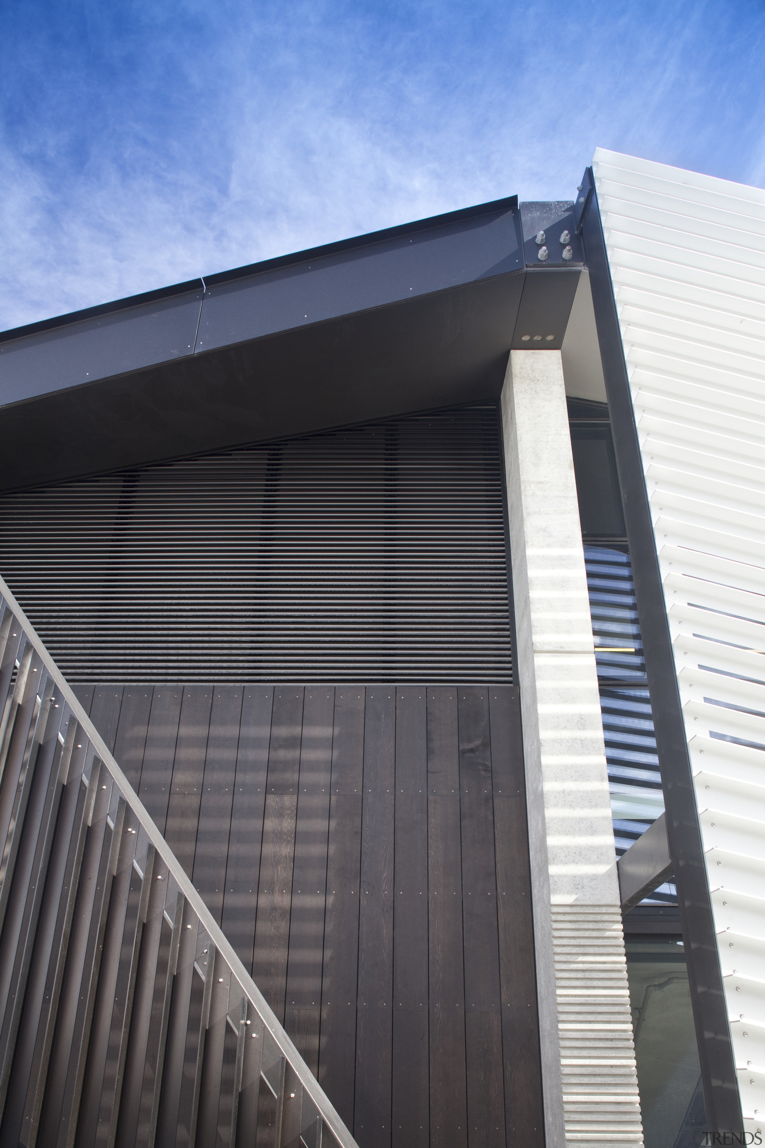 View of roofing and heating systems supplied by architecture, building, commercial building, corporate headquarters, daylighting, daytime, facade, house, line, metropolitan area, residential area, roof, siding, sky, structure, window, black