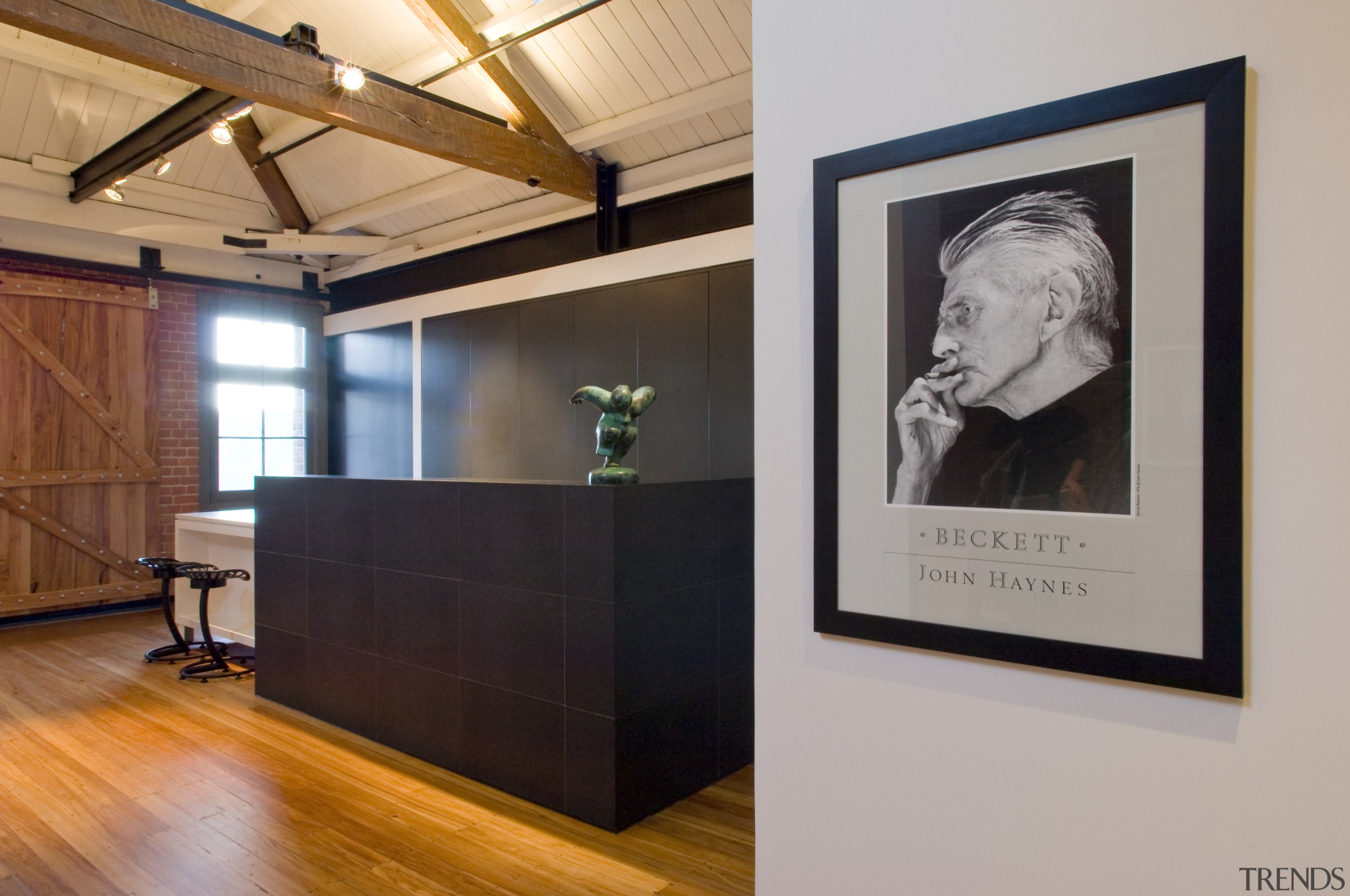 The kitchen of the loft is concealed by exhibition, furniture, interior design, gray