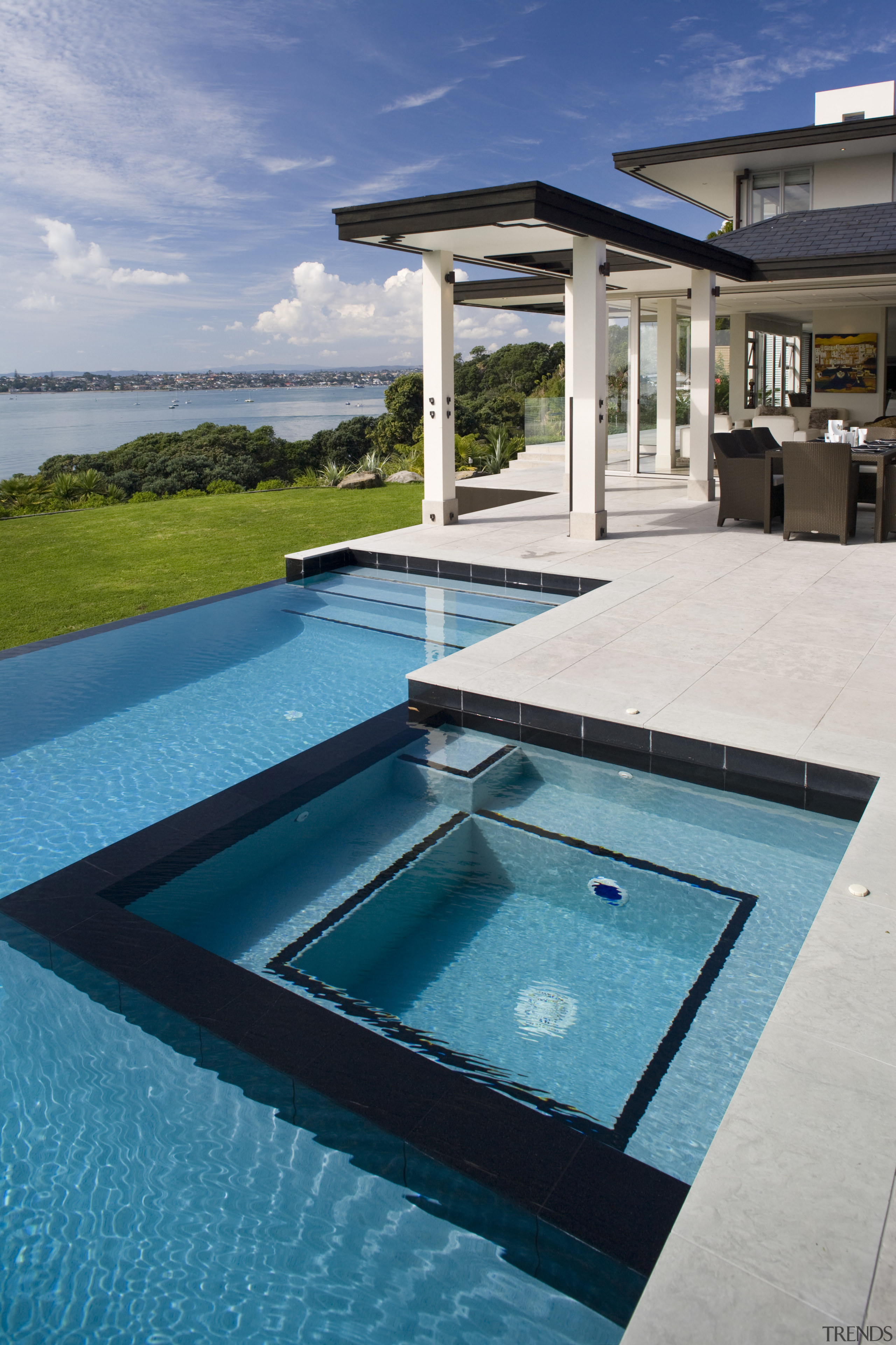 The pool and spa are lined with an estate, leisure, real estate, swimming pool, water, teal