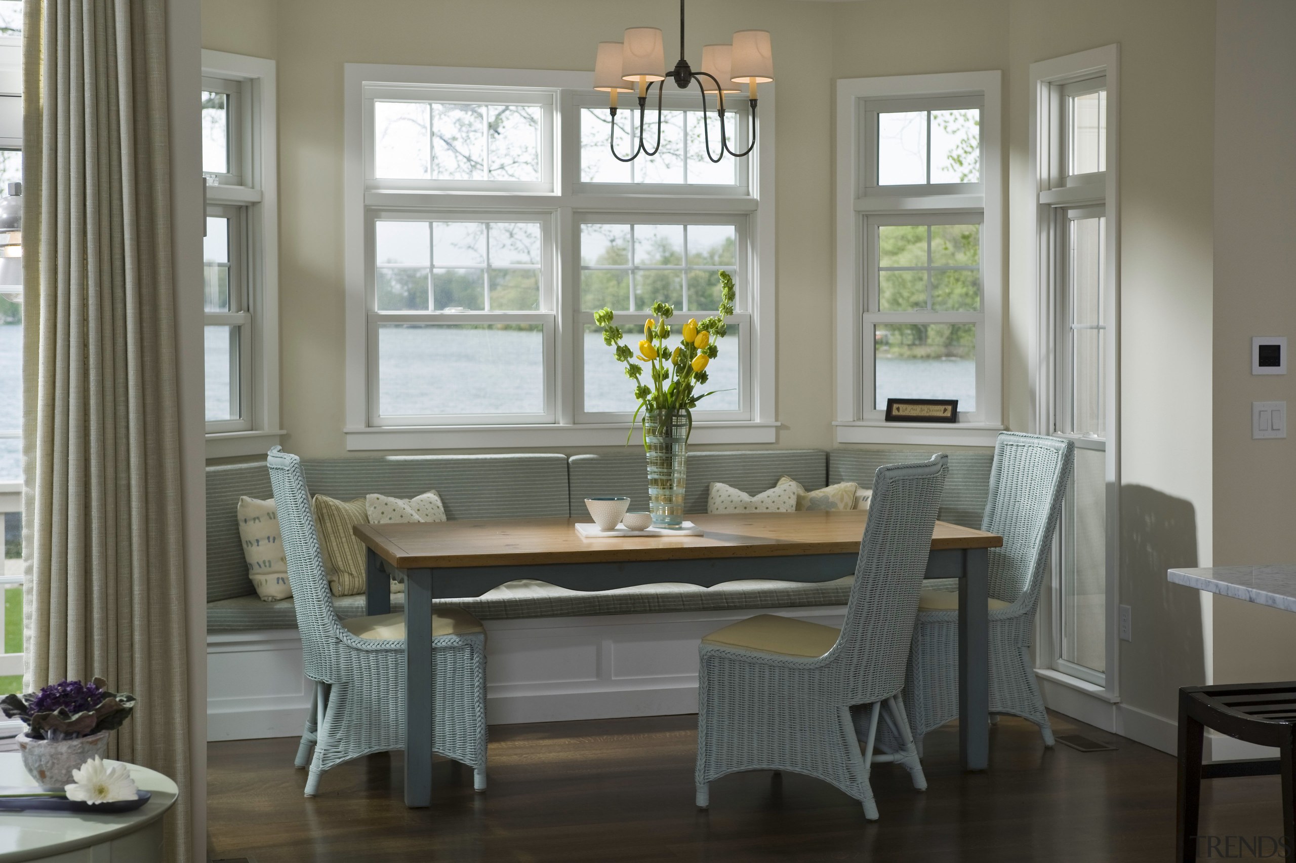 View of casual dining area in window seat chair, dining room, door, floor, furniture, hardwood, home, interior design, living room, room, sash window, table, window, window covering, window treatment, wood, gray