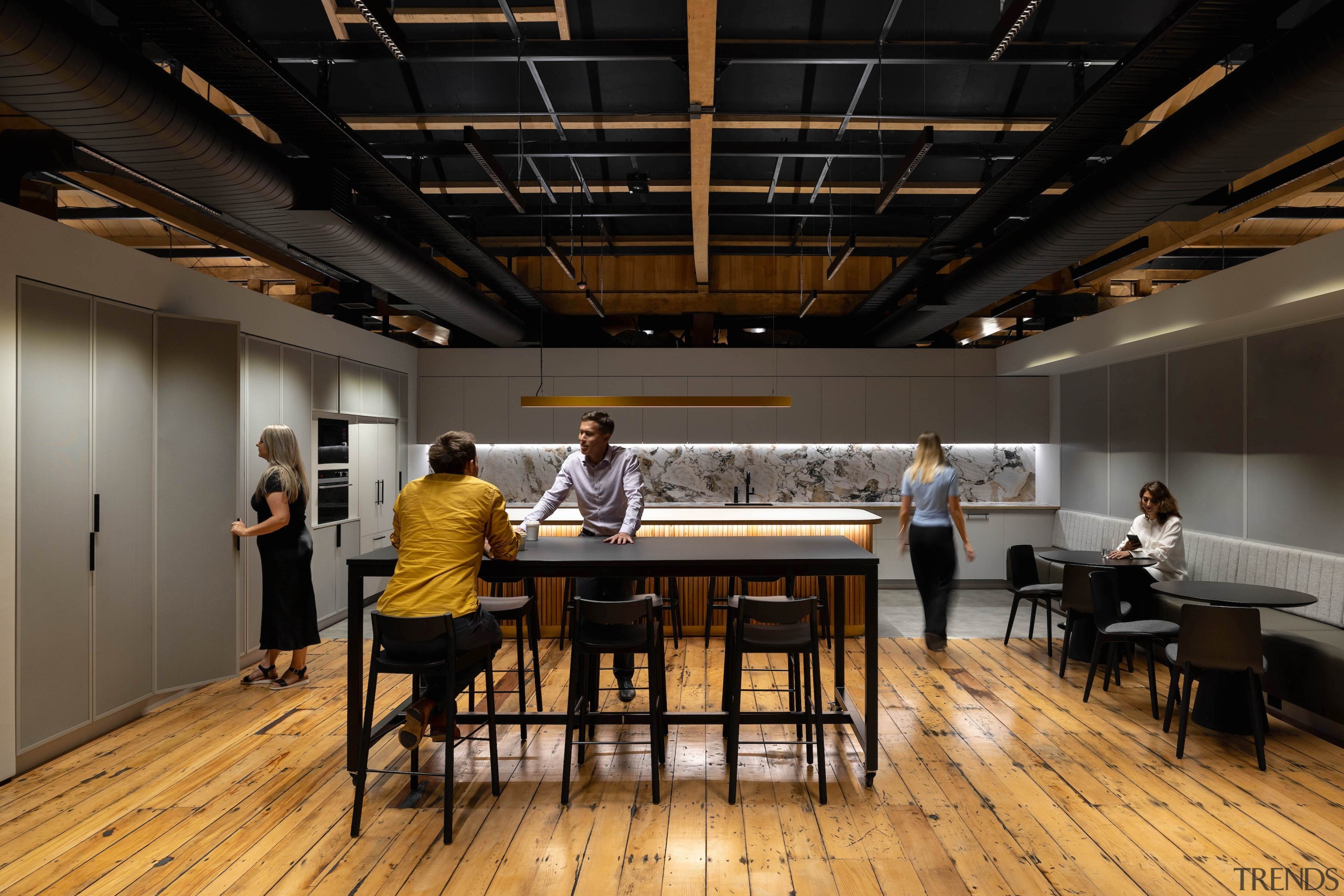 Timber floors and exposed services both contribute to 