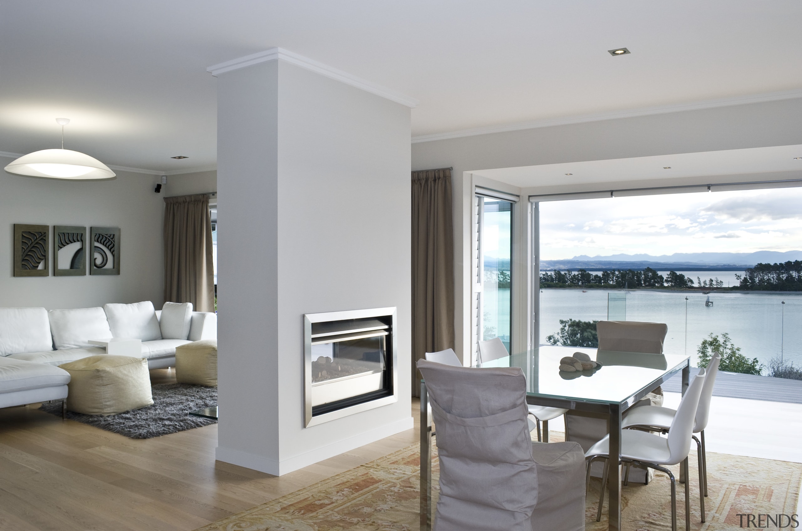 View of the Through Wall Minimal fireplace from floor, flooring, home, interior design, living room, property, real estate, window, wood flooring, gray