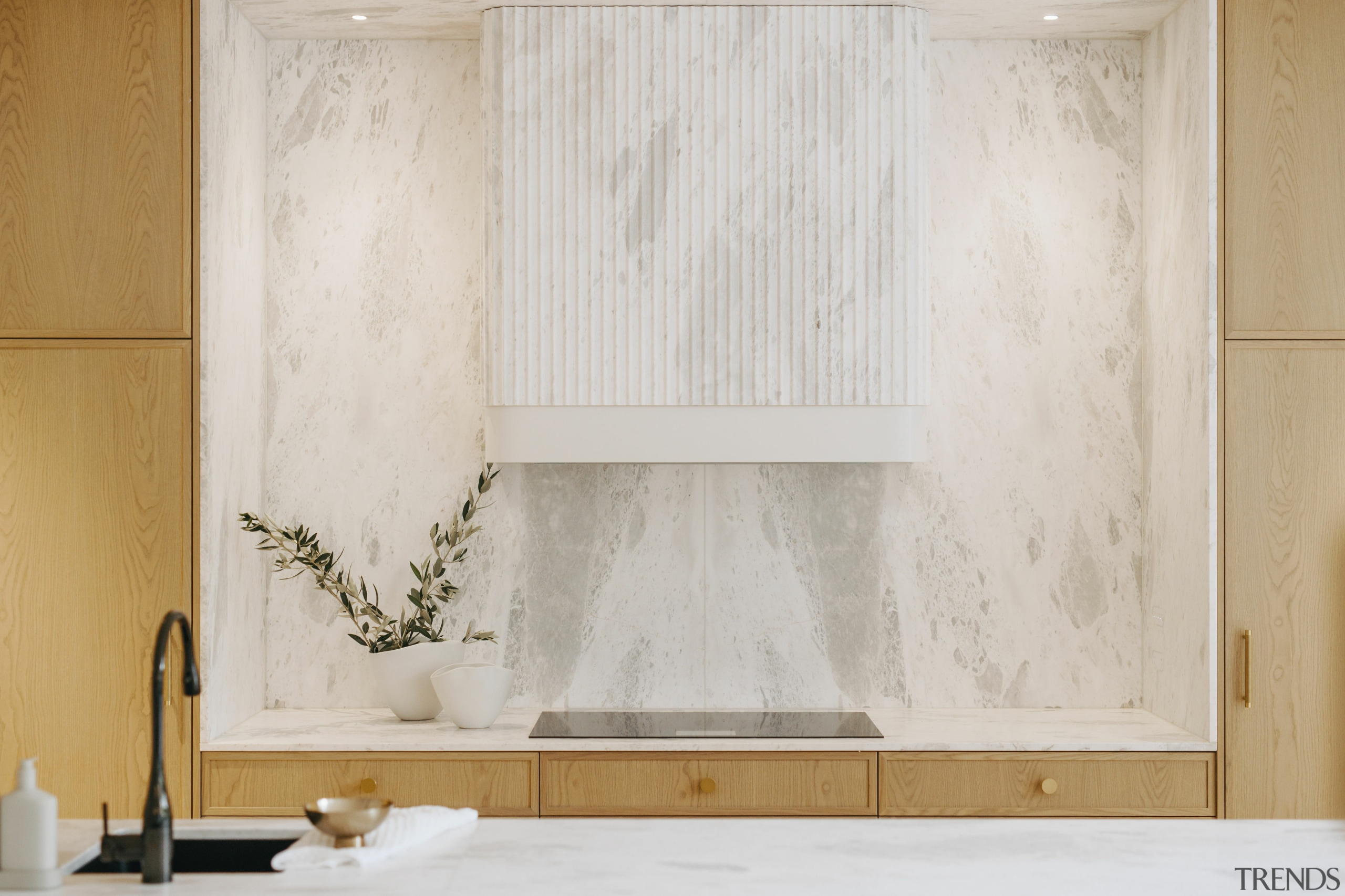 The honed Aquila marble splashback and fluted marble 