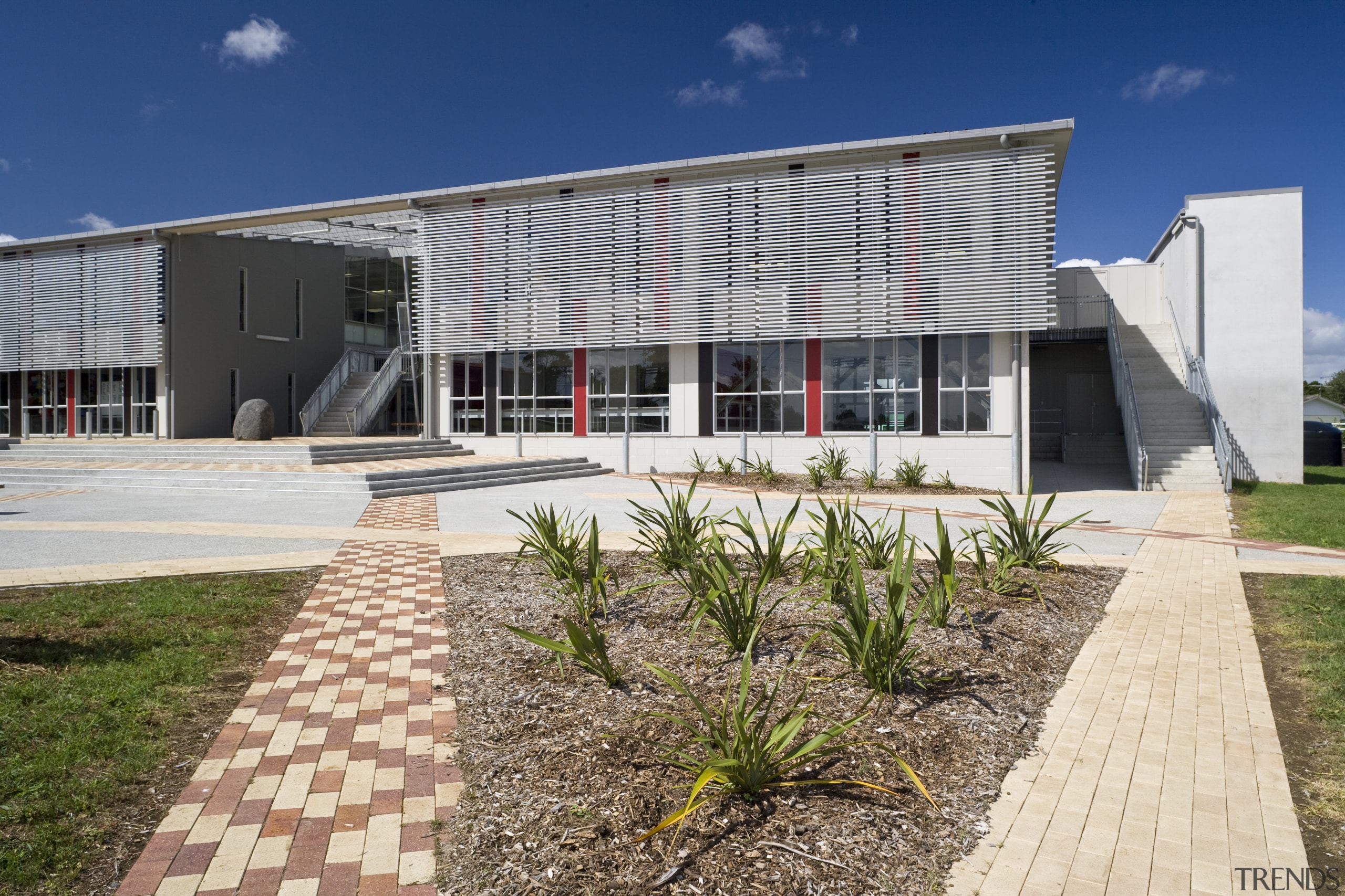 Image of Te Whanau o tupuranga school which architecture, corporate headquarters, estate, facade, home, house, property, real estate, residential area, white