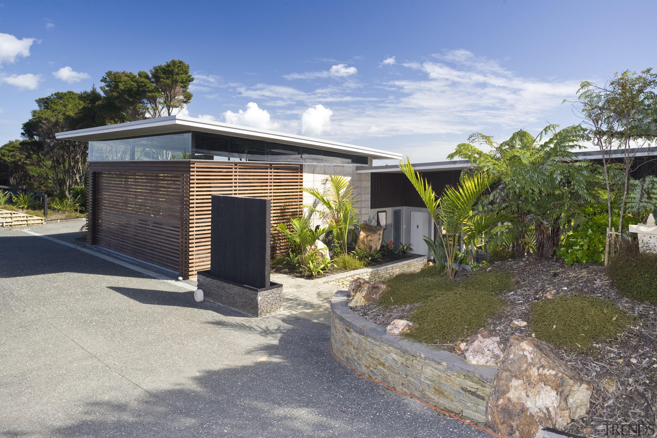 View of the exterior of this holiday home cottage, home, house, property, real estate, shed, gray