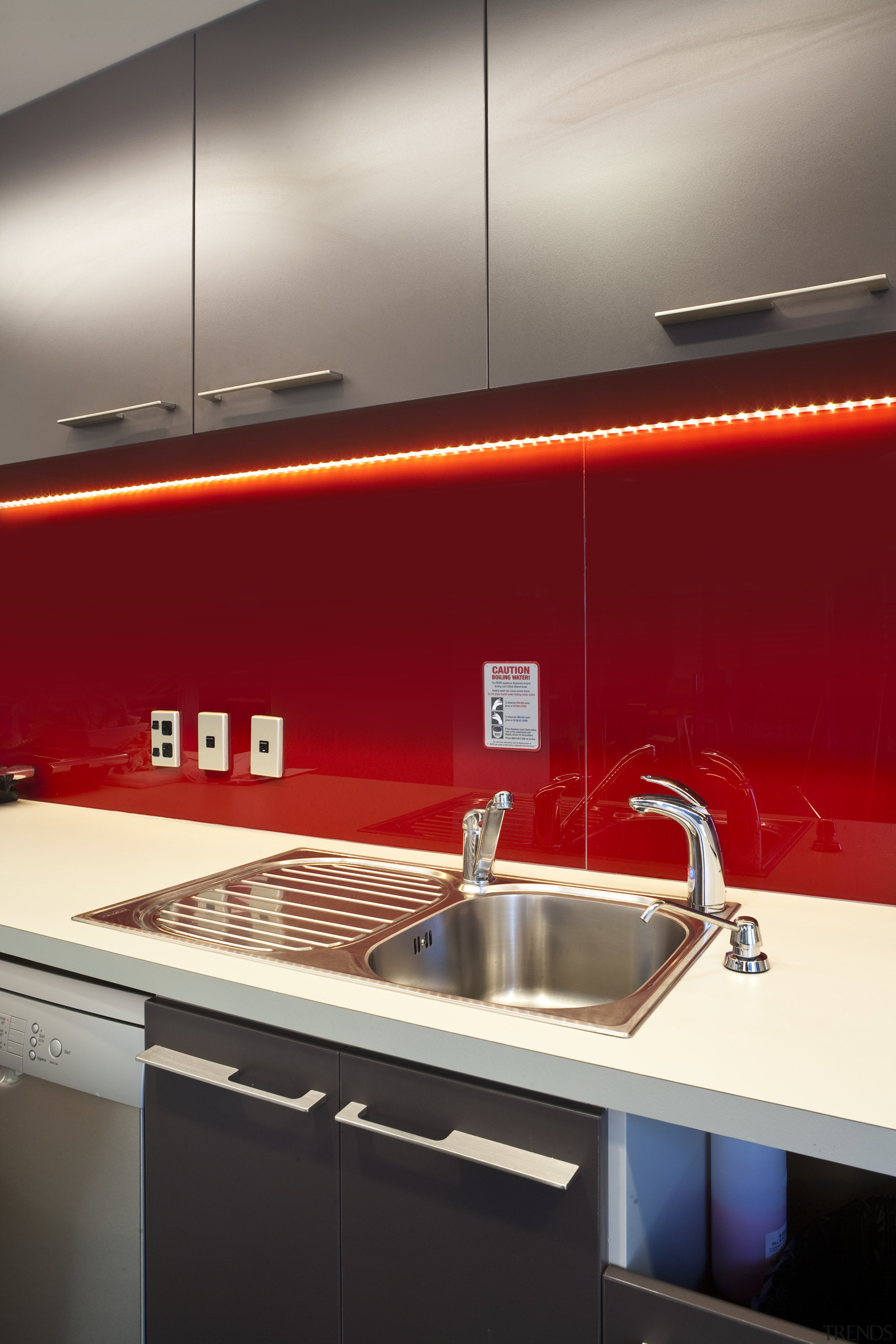 View of the staff kitchen at the BNZ ceiling, countertop, glass, interior design, kitchen, lighting, product design, sink, under cabinet lighting, red