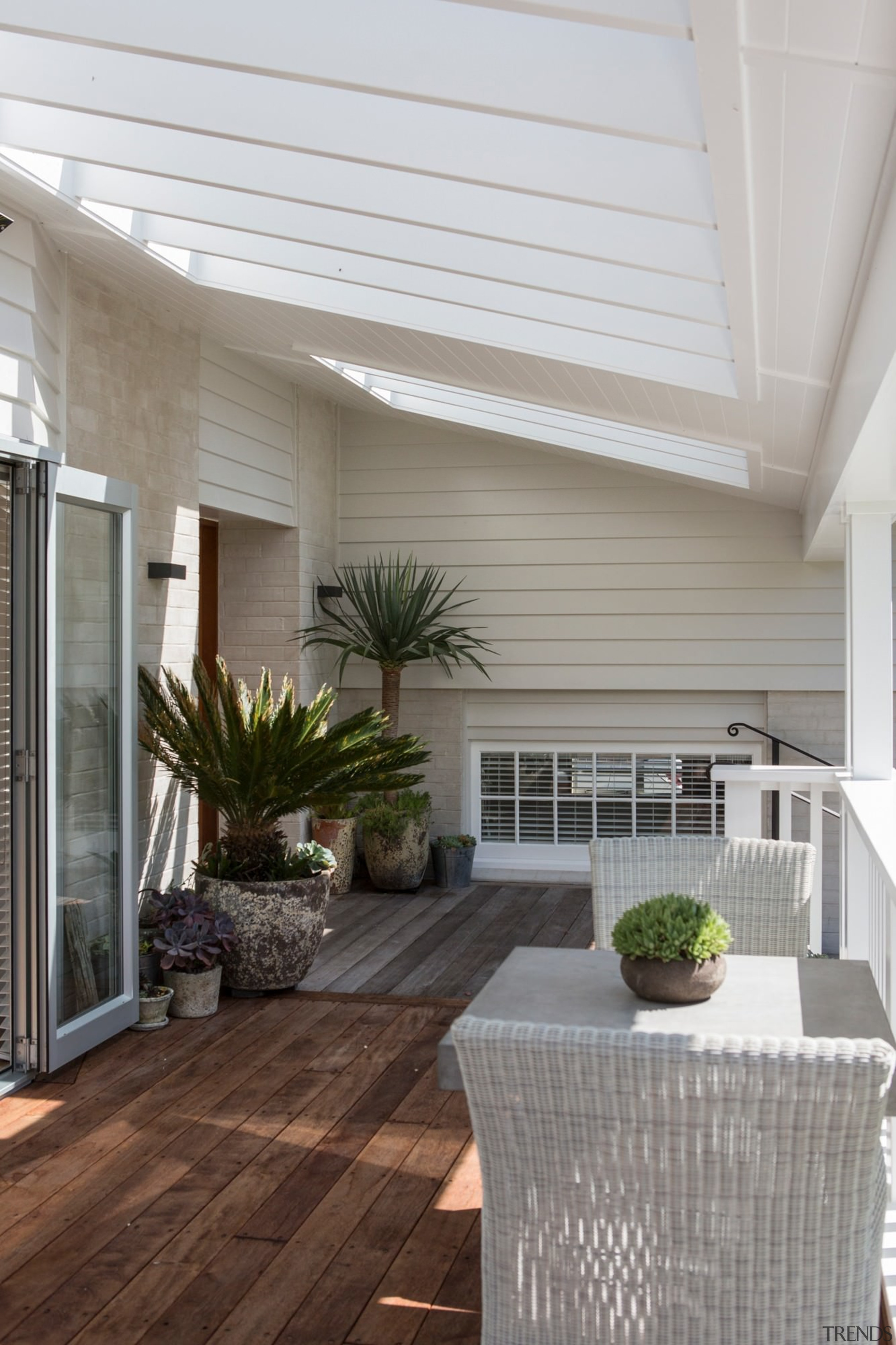 A sheltered outdoor room is a great place ceiling, daylighting, deck, floor, hardwood, home, house, interior design, laminate flooring, living room, outdoor structure, patio, porch, real estate, roof, siding, window, gray
