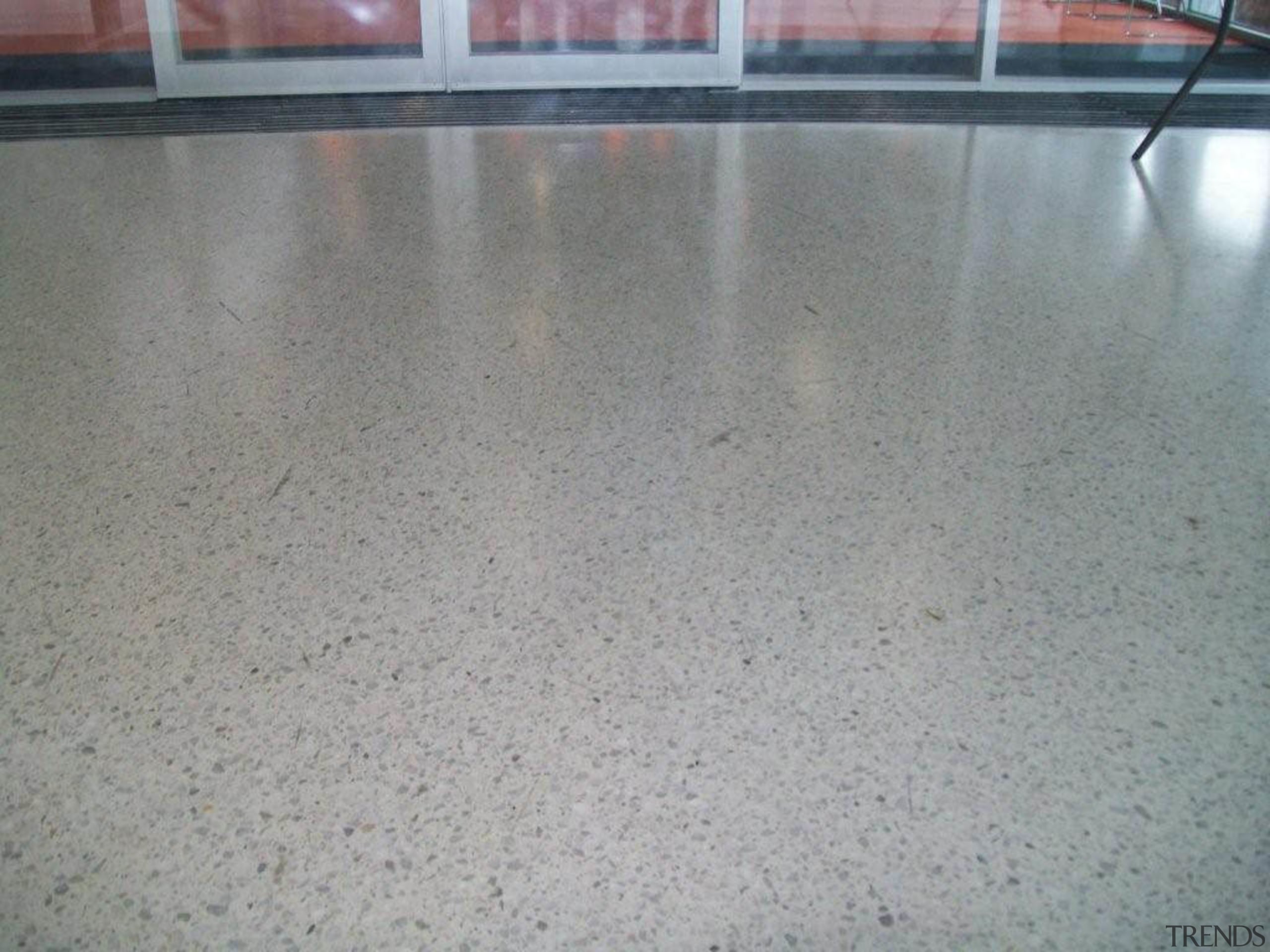 view of concrete flooring with exposed pebbles available concrete, floor, flooring, material, road surface, gray