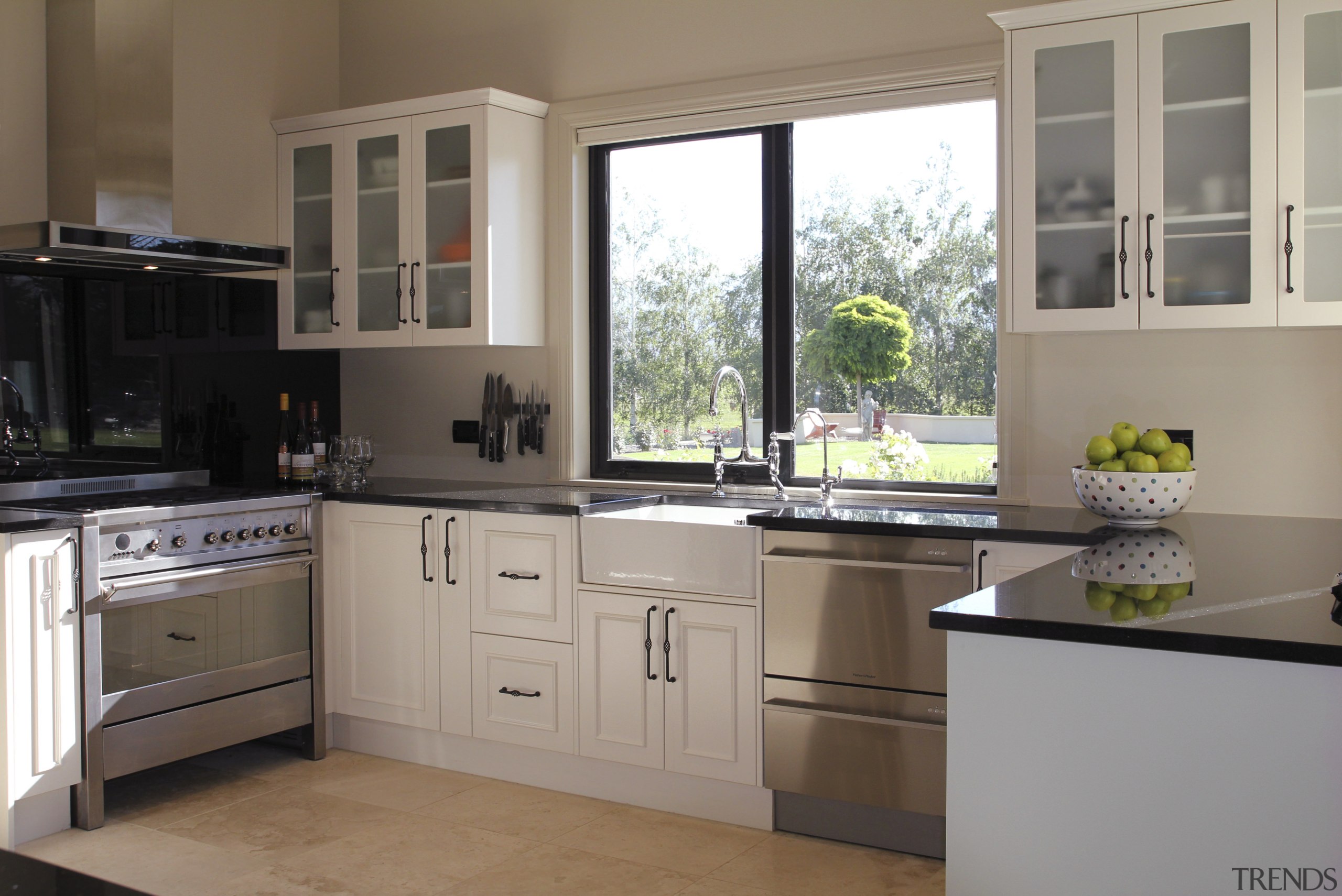 View of a kitchen designed and manufactured by cabinetry, countertop, cuisine classique, home appliance, interior design, kitchen, real estate, room, window, gray, brown