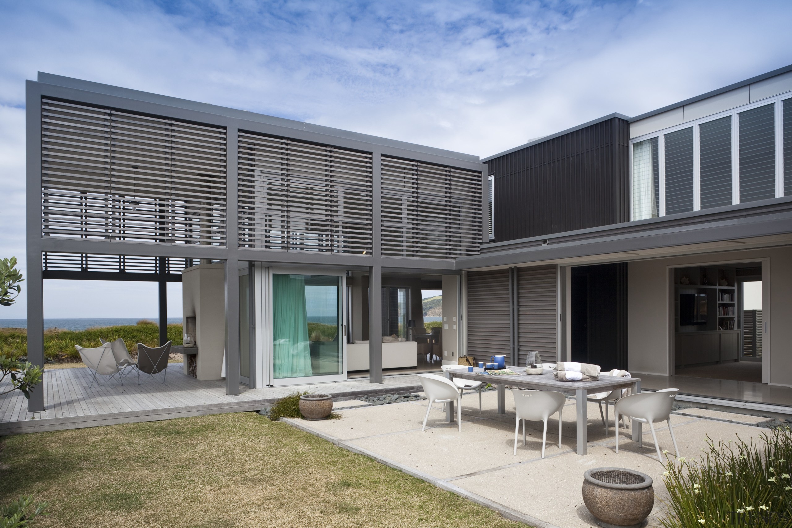 View of contemporary beach house with wooden flooring architecture, daylighting, estate, facade, home, house, interior design, property, real estate, window, gray