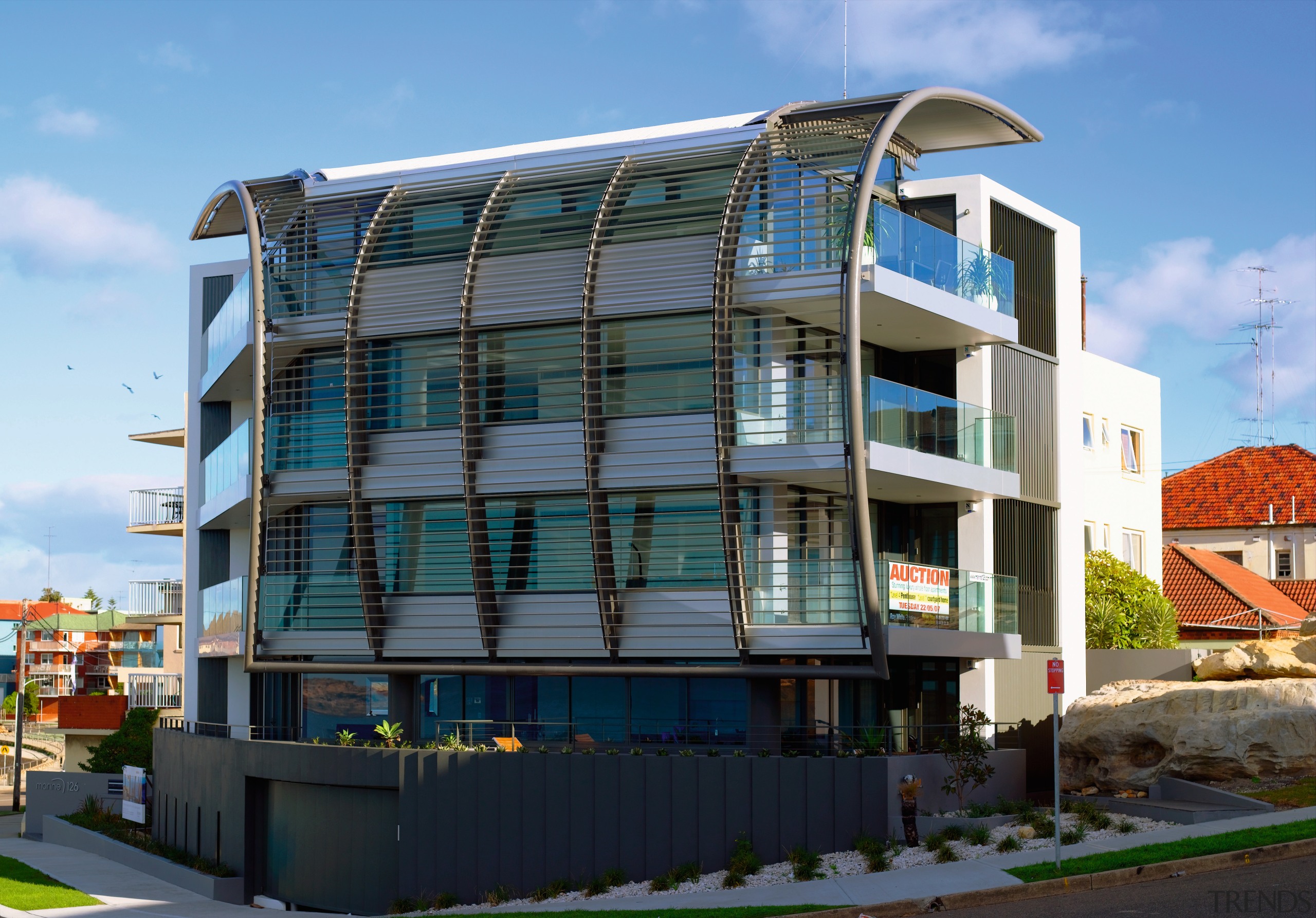 A view of this Apartment block featuring Louvres apartment, architecture, building, commercial building, condominium, corporate headquarters, elevation, facade, home, house, metropolitan area, mixed use, neighbourhood, property, real estate, residential area, teal, black
