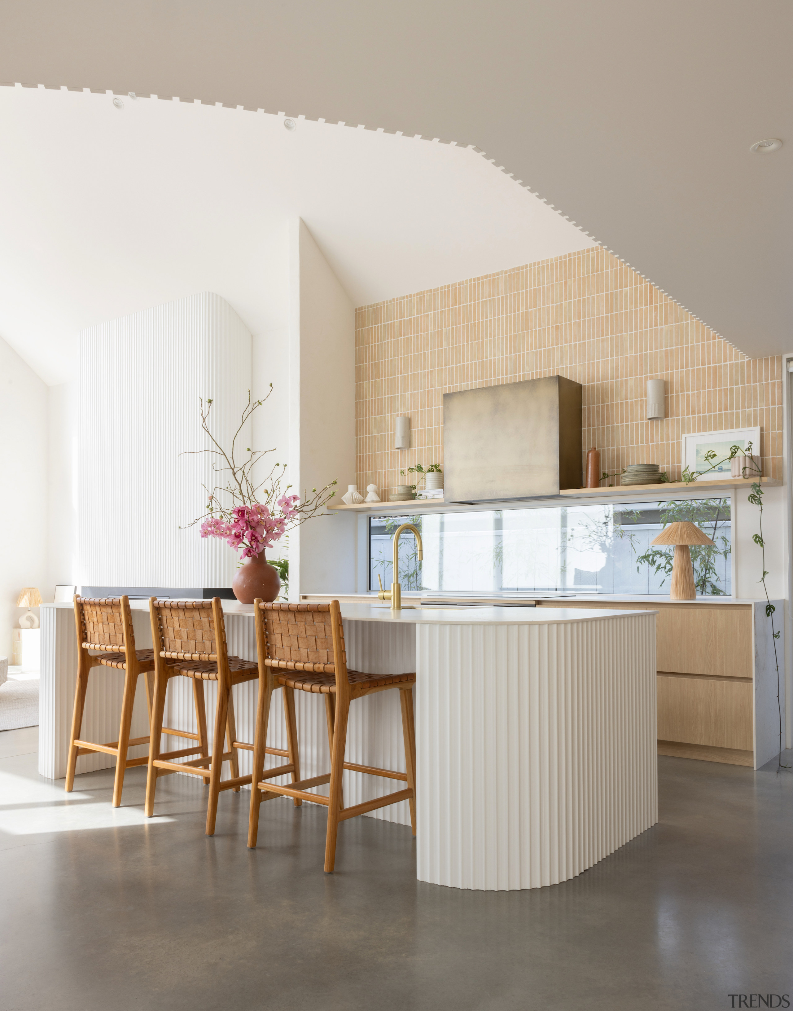 The contemporary kitchen is open to the living 