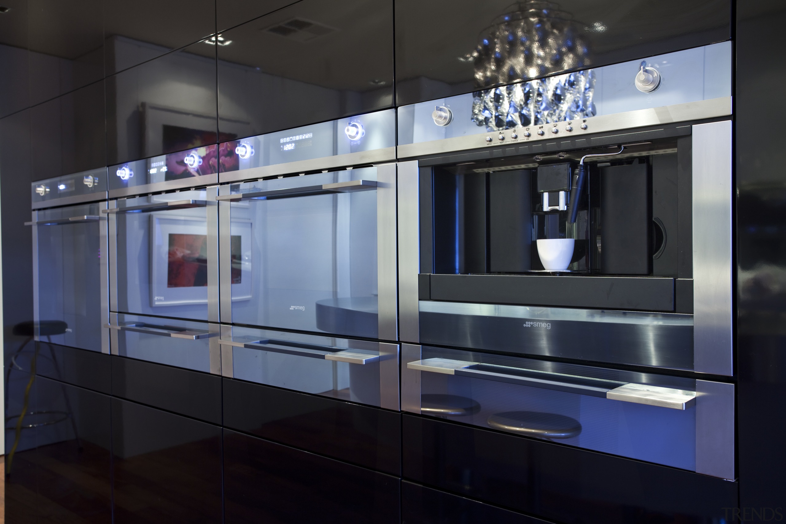 View of a kitchen which features an oval-shaped display case, glass, interior design, kitchen, black